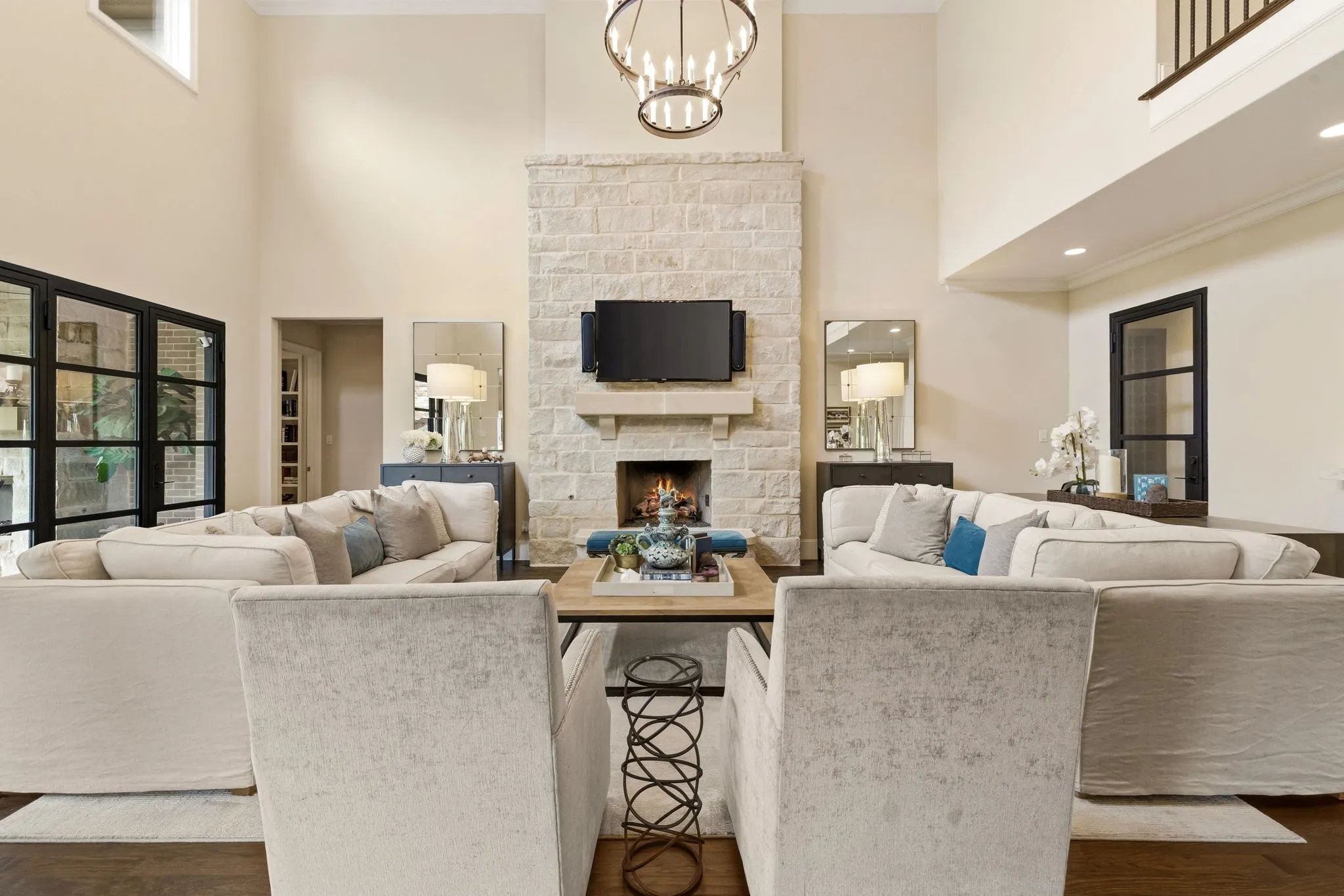 Stone fireplace with gas logs centered in this expansive living room.
