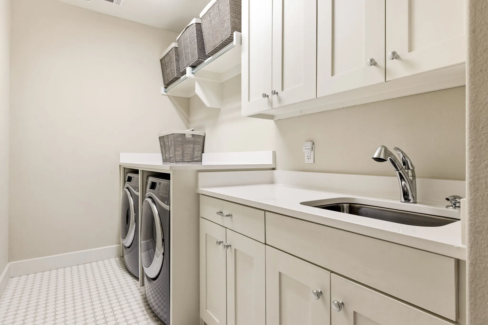 Upstairs laundry room with secondary W/D hookups in primary closet on 1st floor.