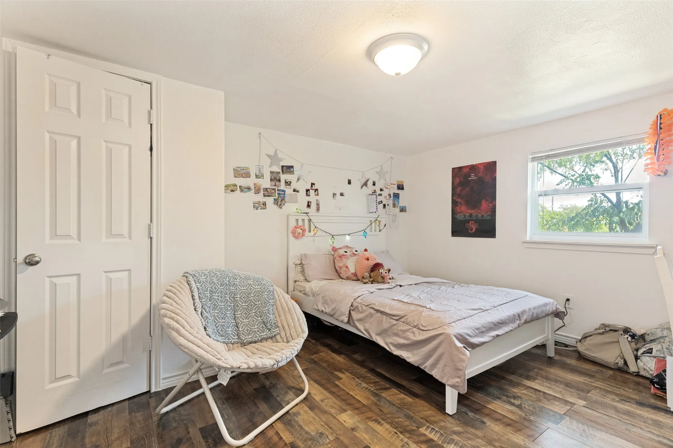 White painted walls with wood-finish flooring