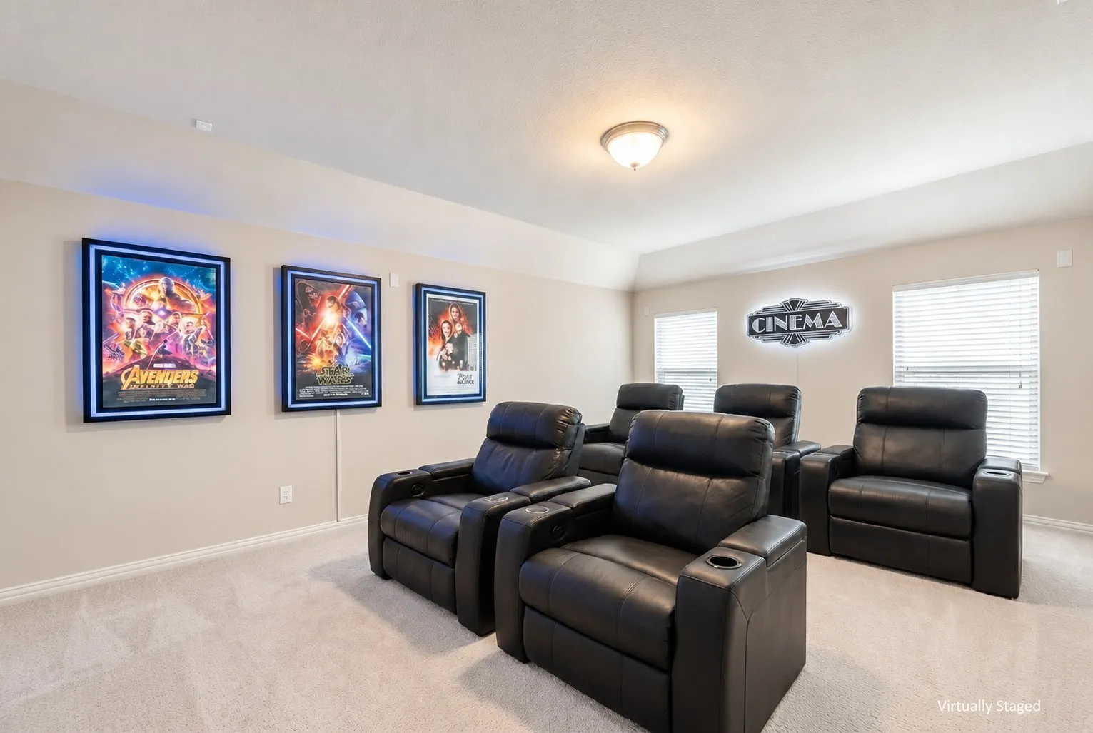 Dedicated entertainment room with plush carpet flooring and a neutral color palette