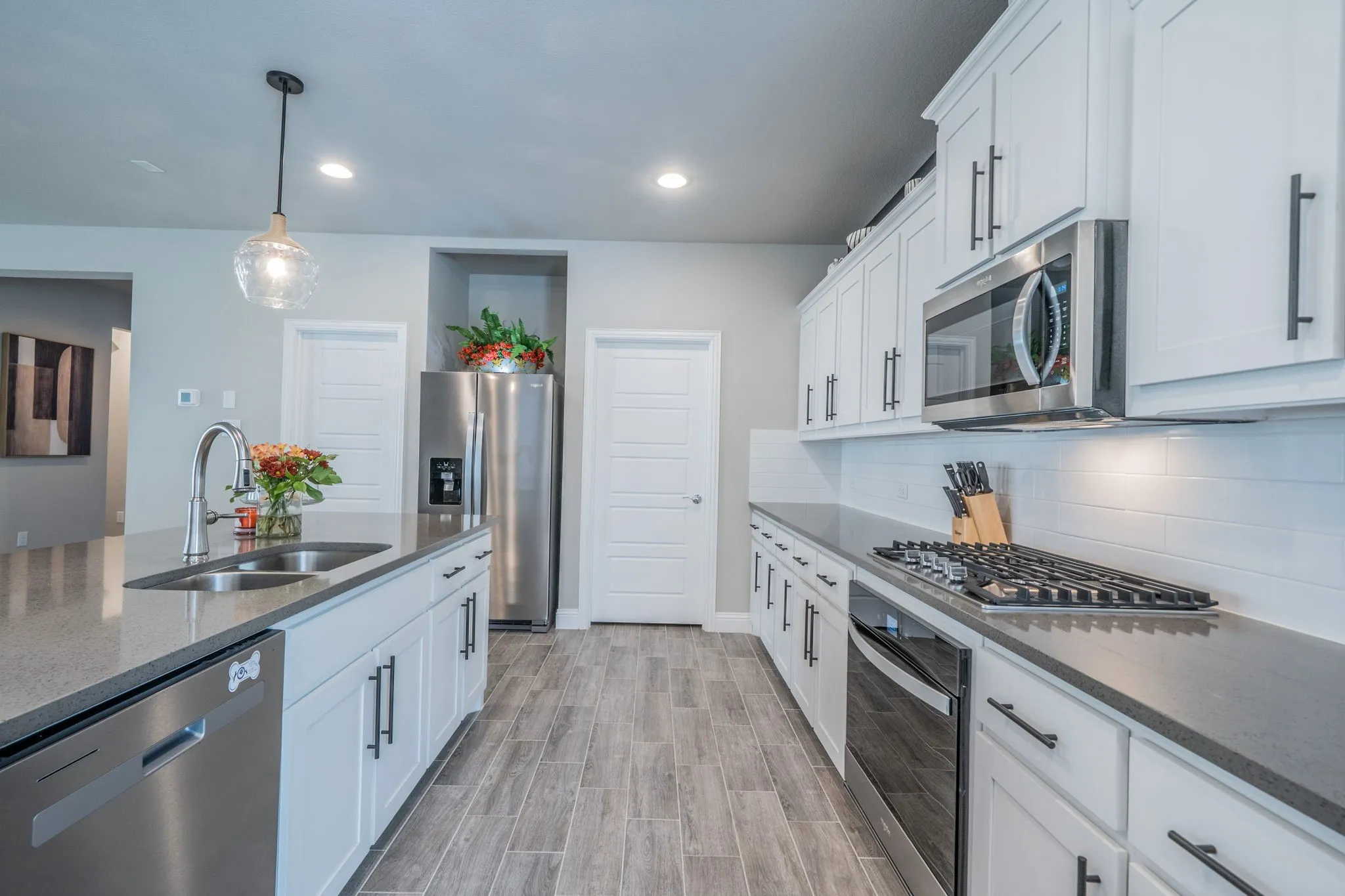 Another view of the kitchen facing the laundry room. Look at all that prep space!