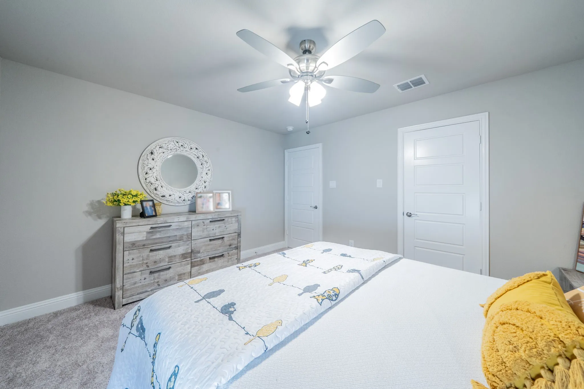 Another view of bedroom 1 featuring an upgraded ceiling fan.