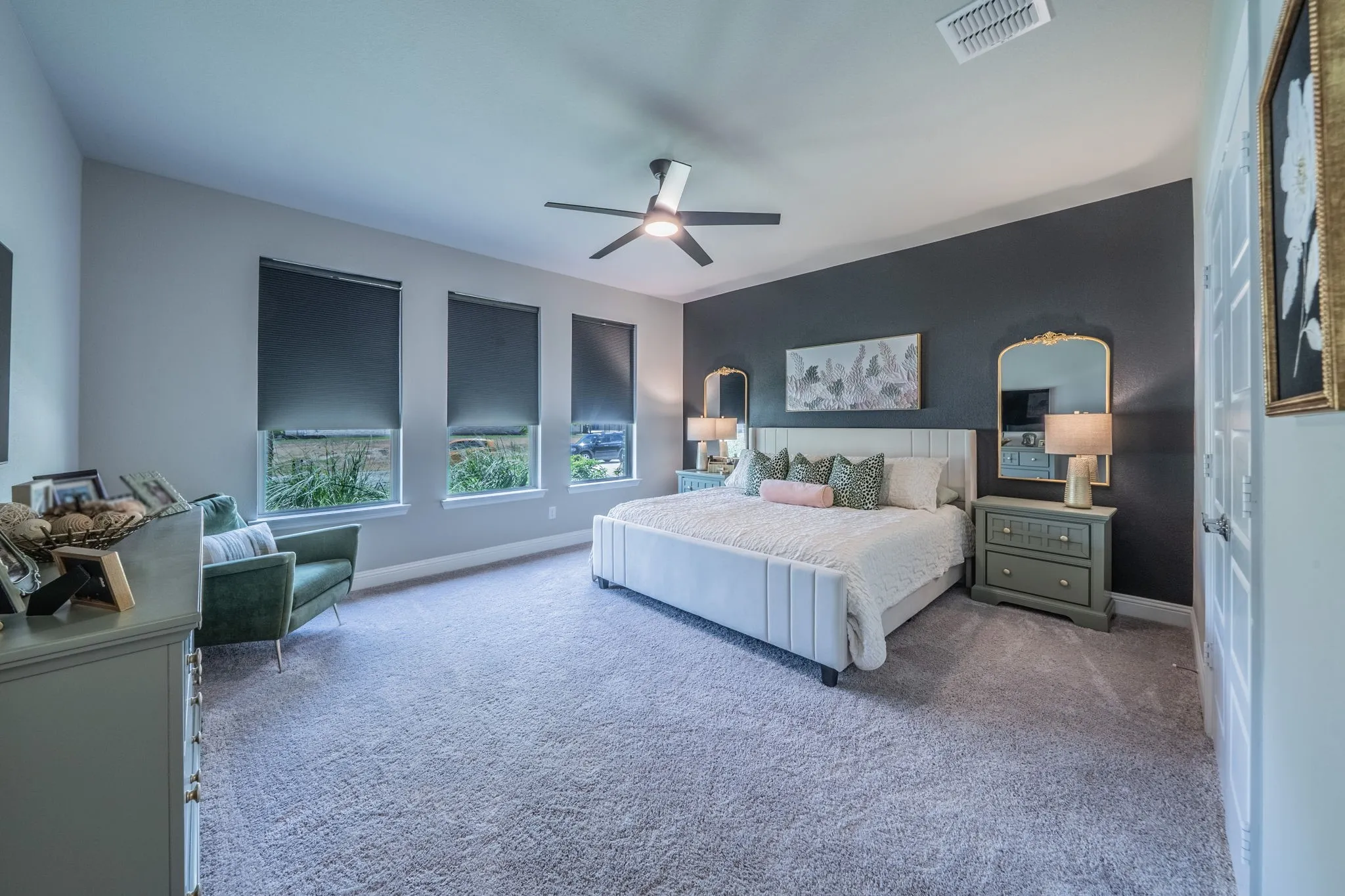HUGE, lovely primary bedroom with natural light and room for a sitting area.