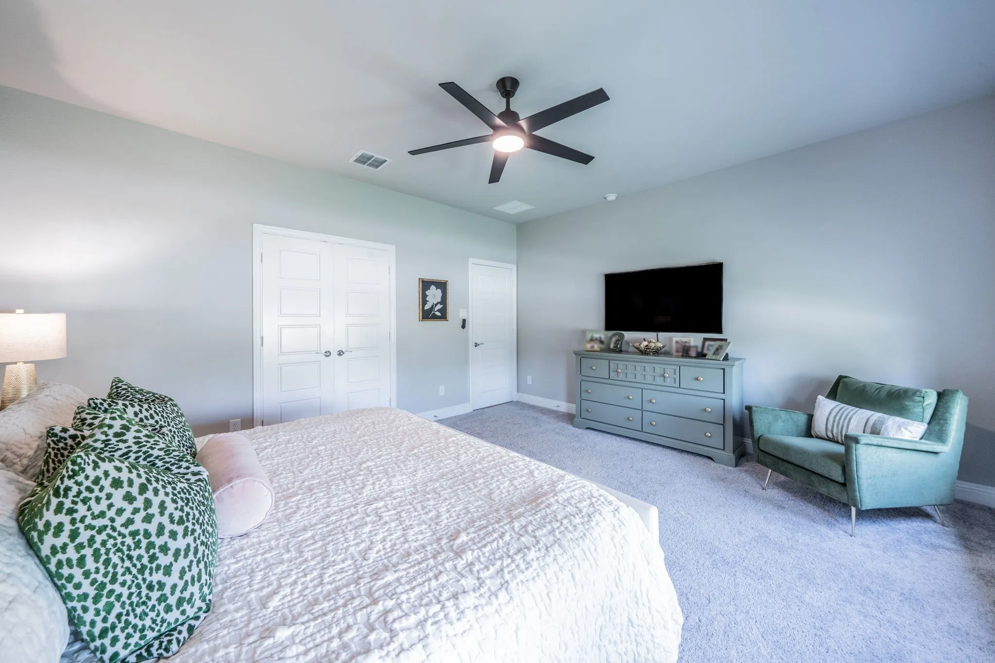 Another view of the primary bedroom facing the entry door. So much space in here!
