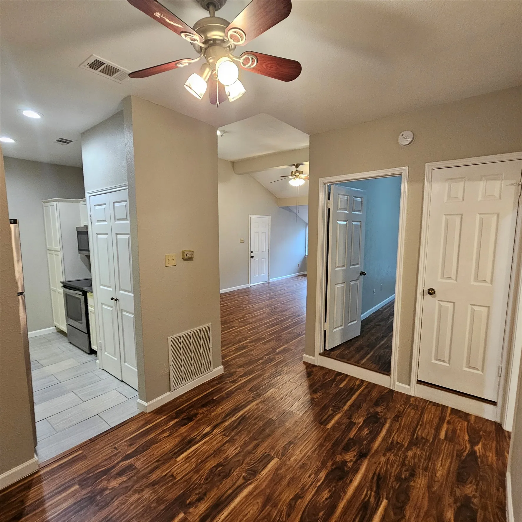 Empty room featuring wood finished floors and ceiling fan