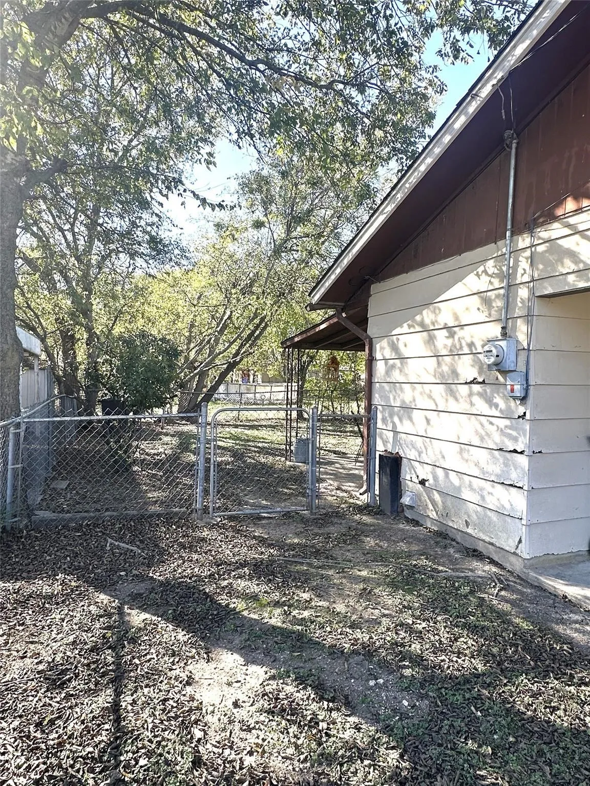 Chain link fence enclosure with gate