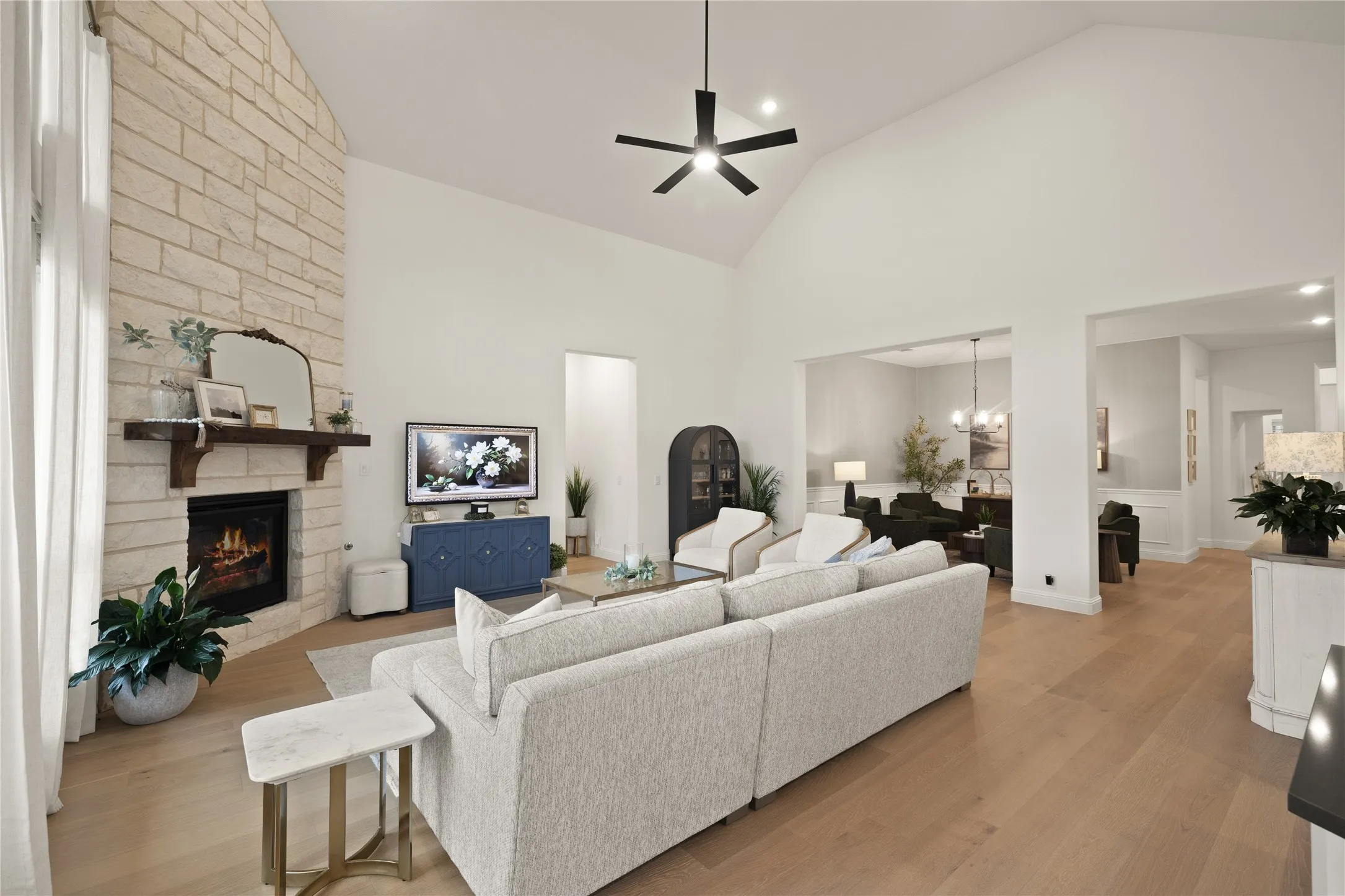 Gas fireplace that sets the stage for your great room. Floor to ceiling windows and recessed lighting. Luxury hardwood planked wood throughout.