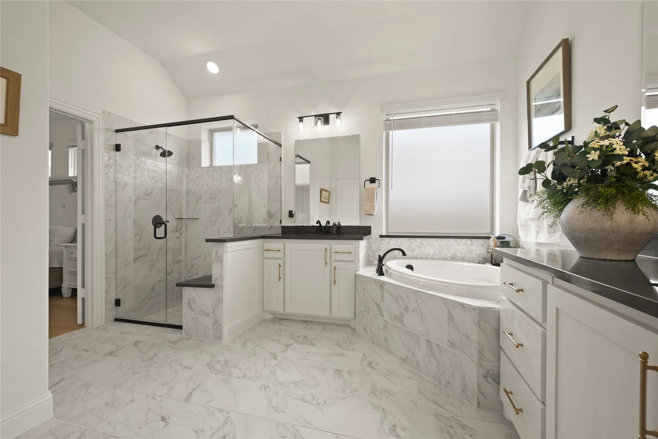 The ensuite bath is like walking into a spa. Well lite, natural light, two vanities and sinks, Storage, large walk in shower or spa like soacking tub and a walk in walk in closet that is ample.