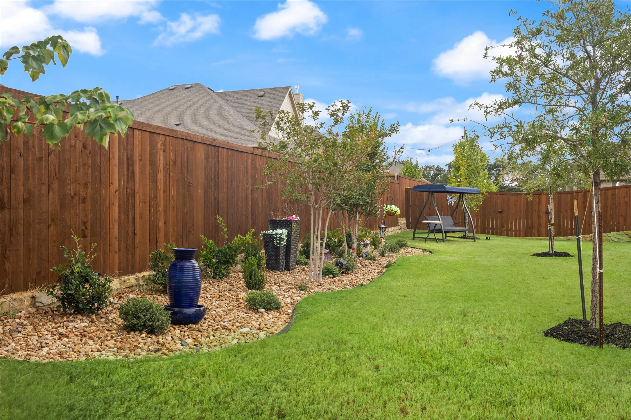 The additional trees were an upgrade, as well as the decorative rock gardens. This premium flat yard space could be whatever you dream it to be. Two ac units to bring extra comfort in Texas summers and winters.