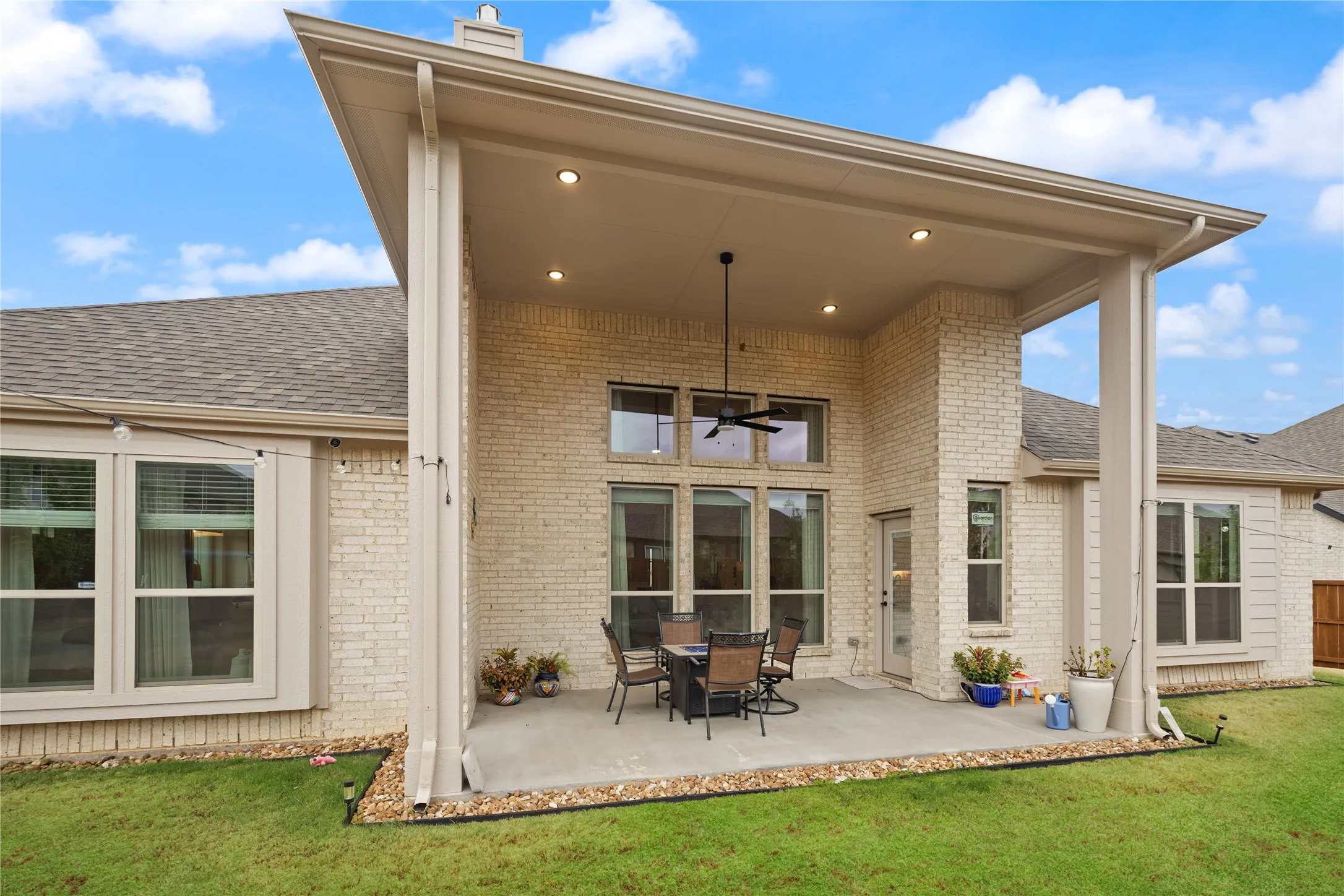 Striking back porch design, with recessed lighting and soaring coverage for entertaining.