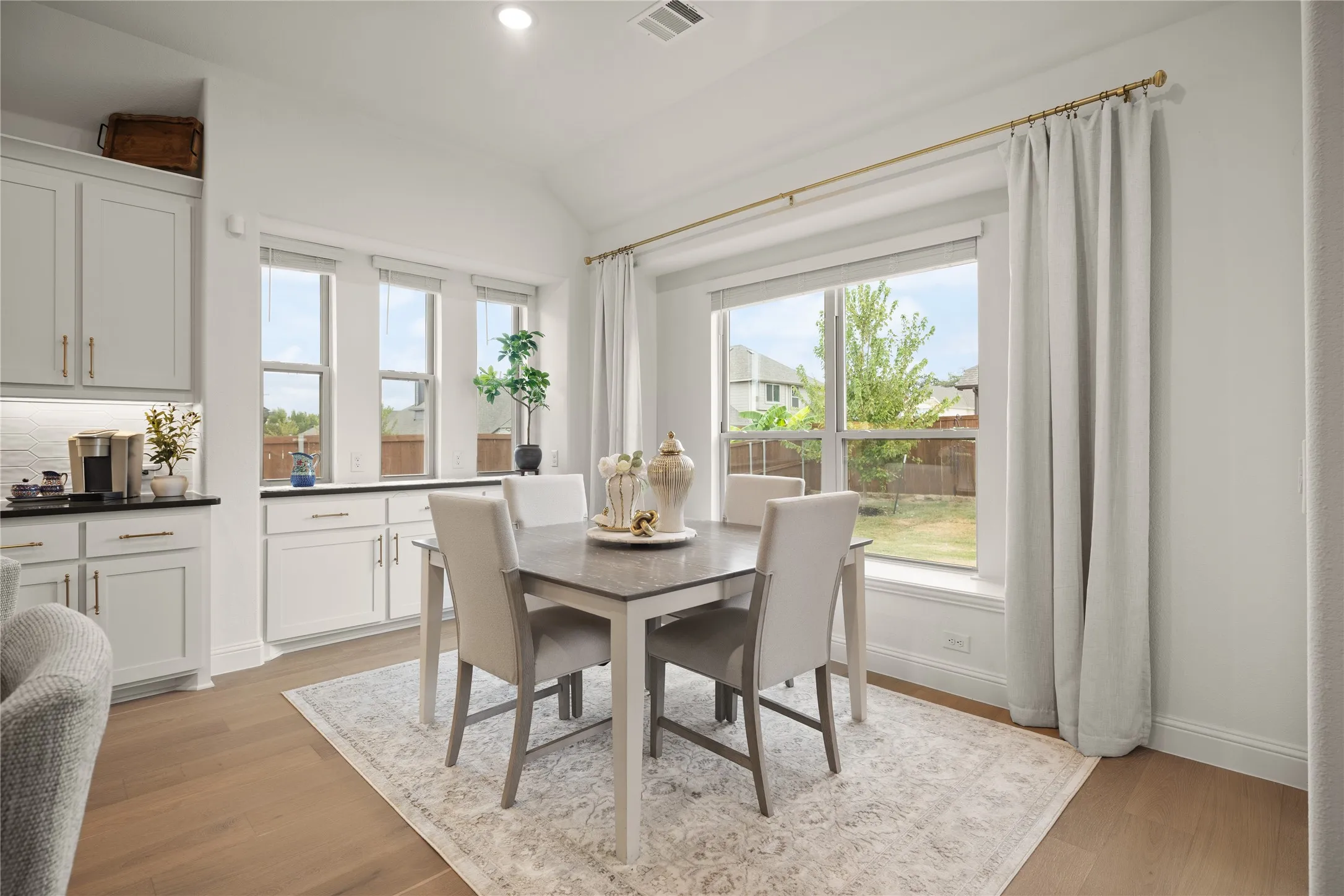 Dining room with built in buffet and storage. You have the view of your backyard from the wide open windows
