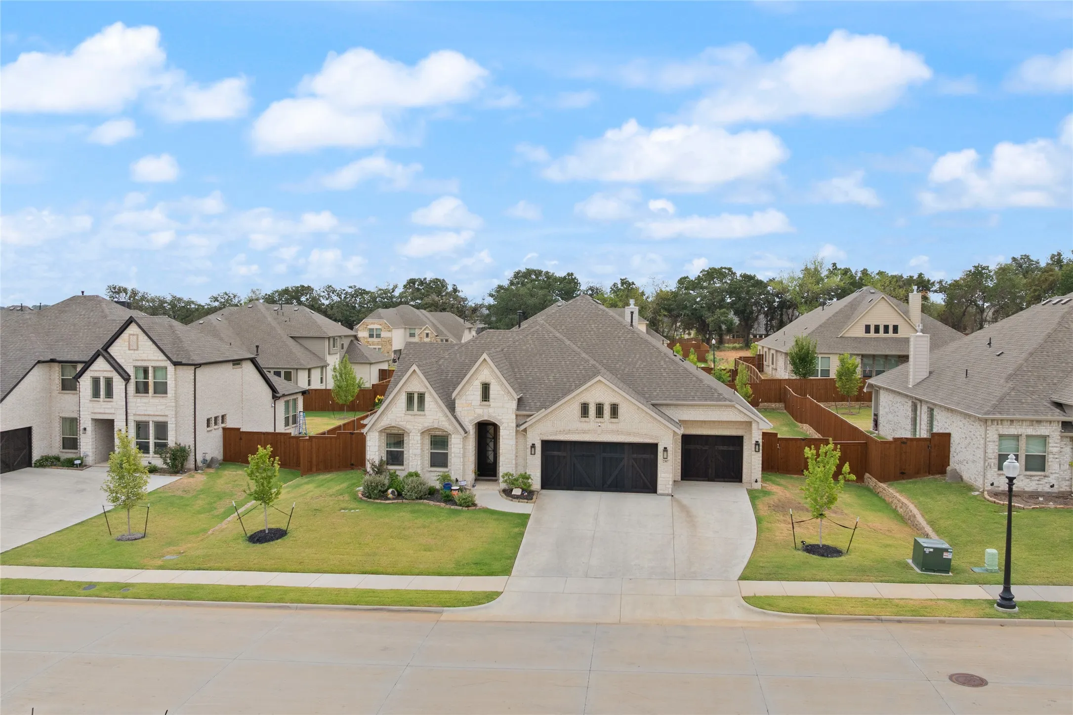 Premium 1/3  of an acre elevated landscape with additional trees and rock garden accents