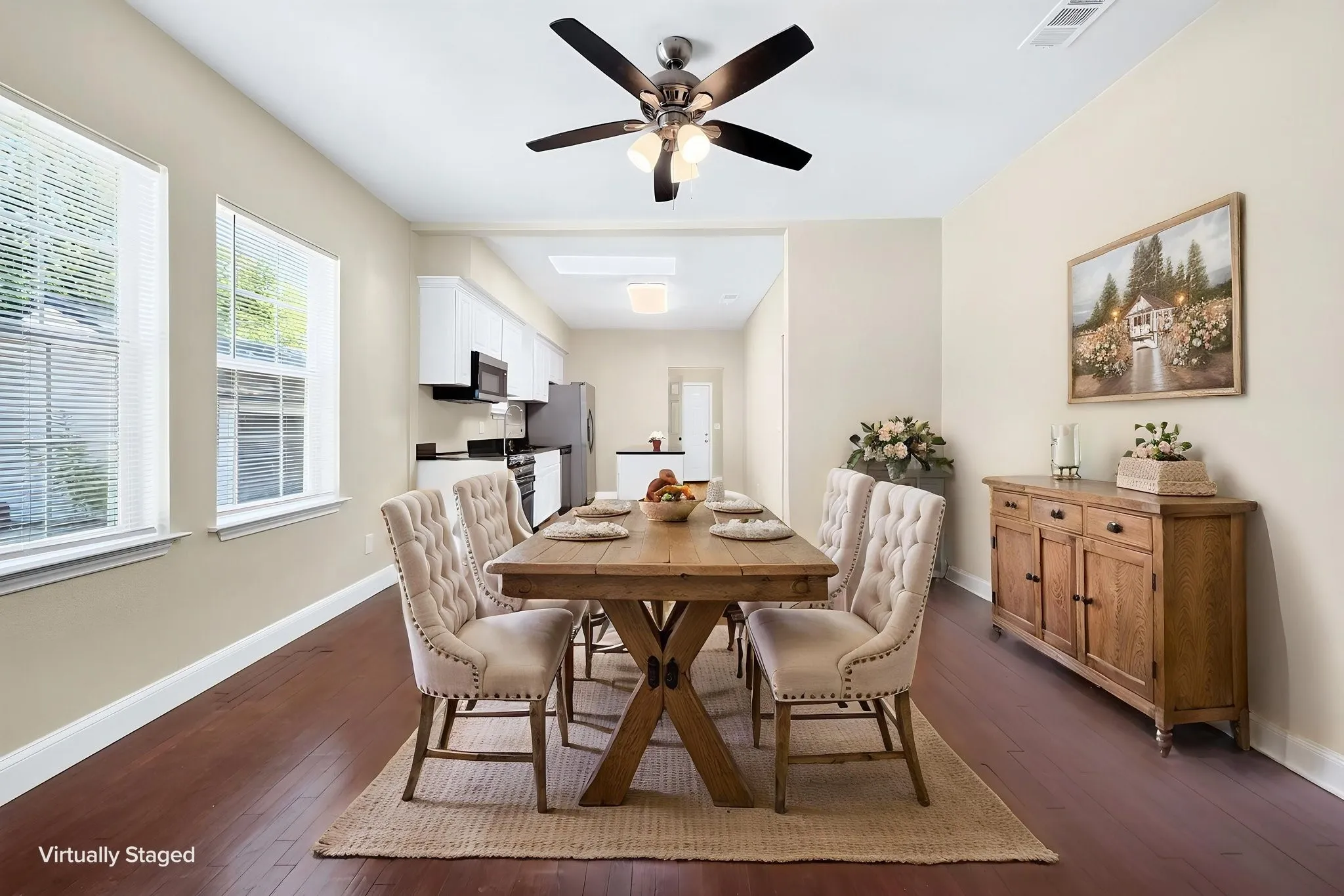 Hardwood-style flooring, white trim, and light wall tones