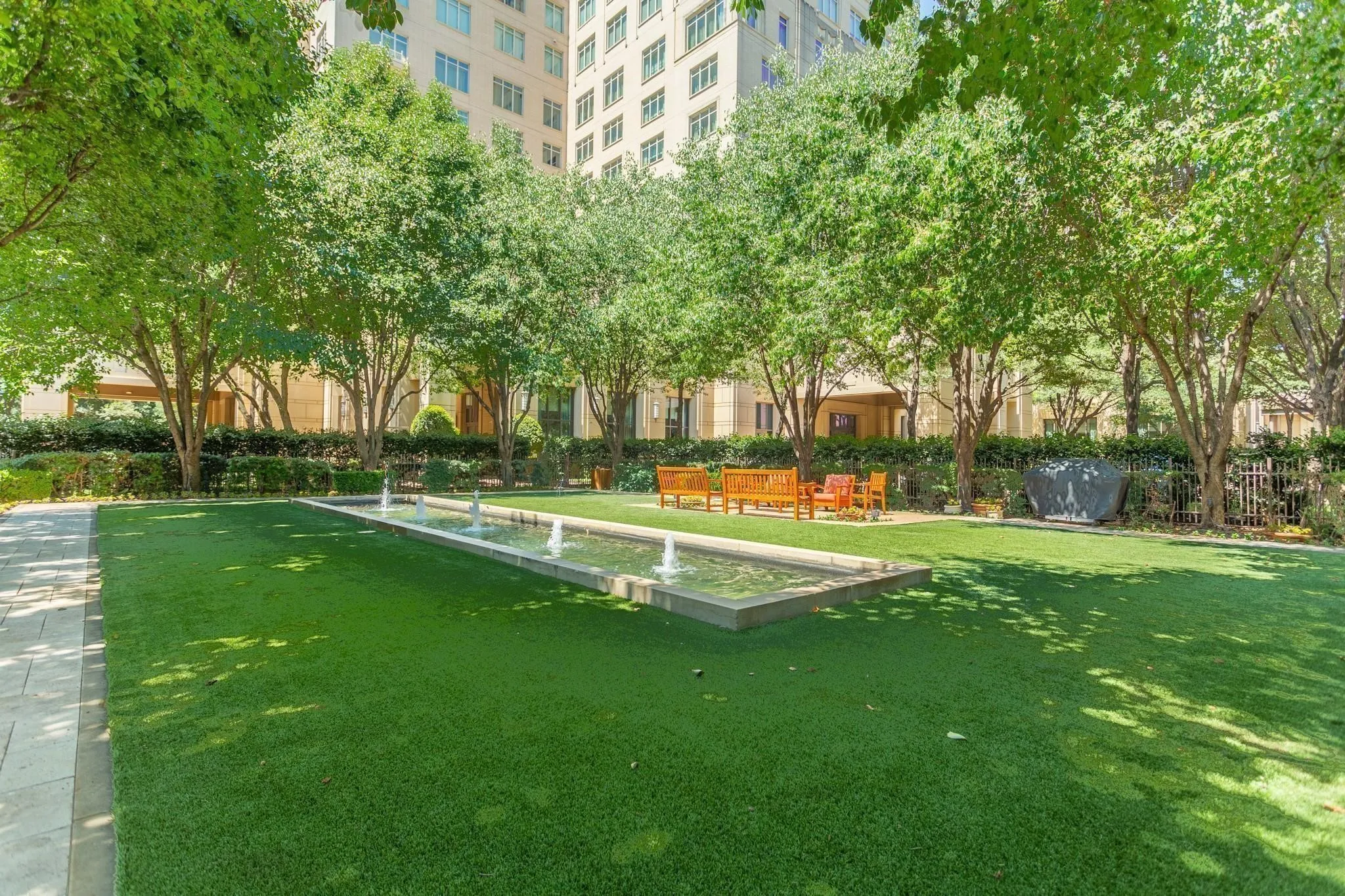 An oasis in the city, the Reflection Fountain Park has moon-lighted trees and a grill.