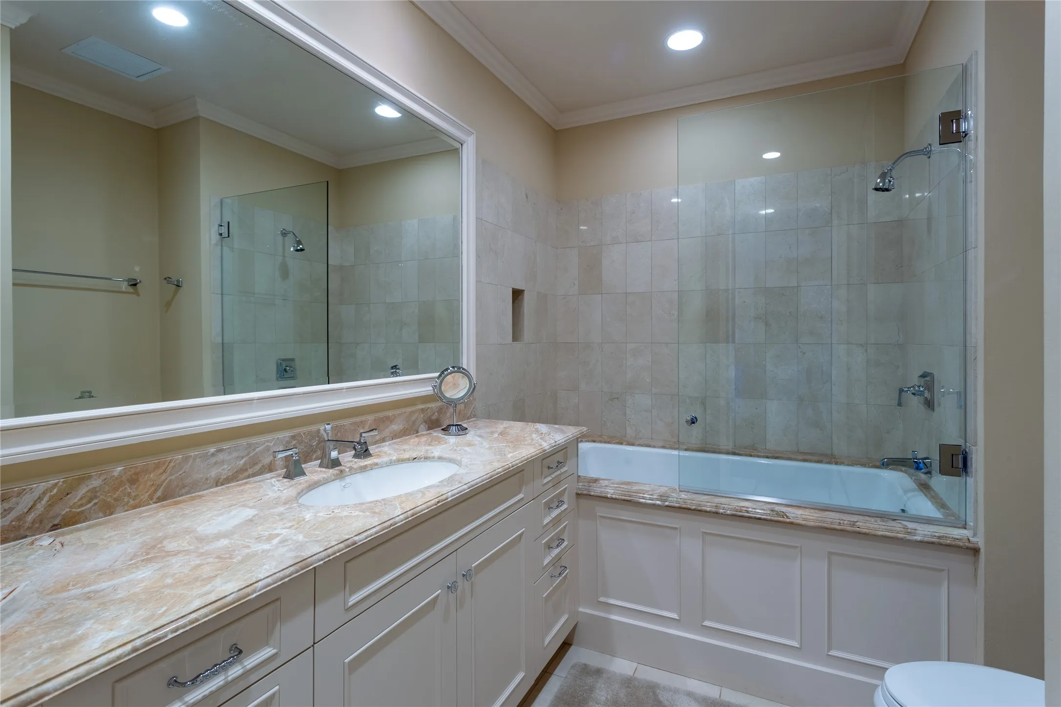 Ensuite Guest Bath has a large walk-in closet & linen closet.