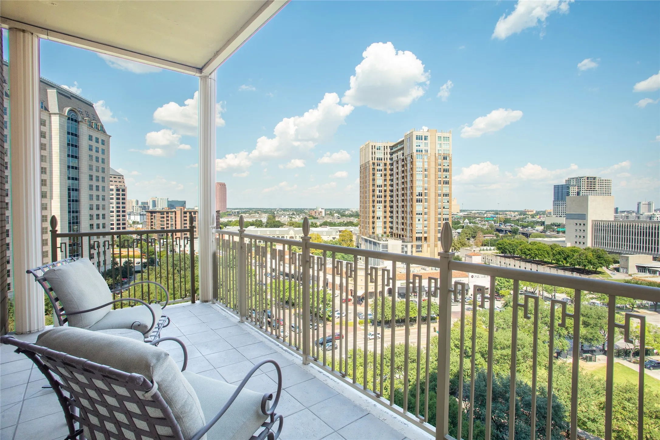Enjoy morning coffee from the corner Balcony overlooking Uptown.