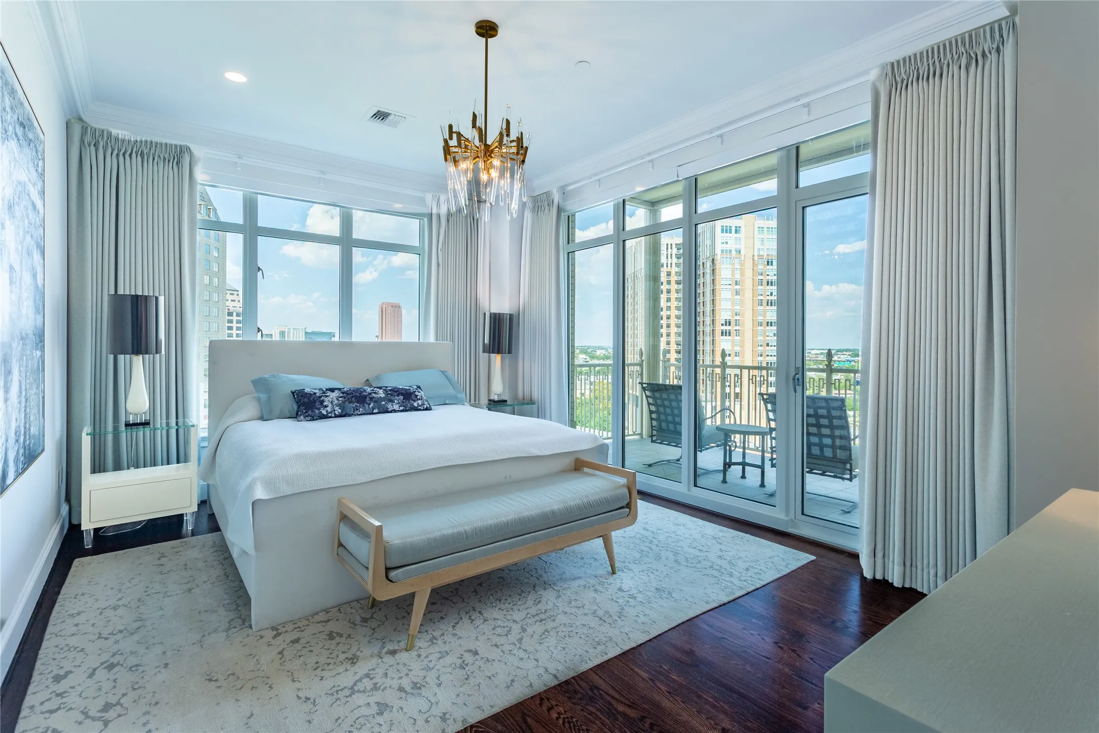 Primary Bedroom overlooks the Corner Balcony.