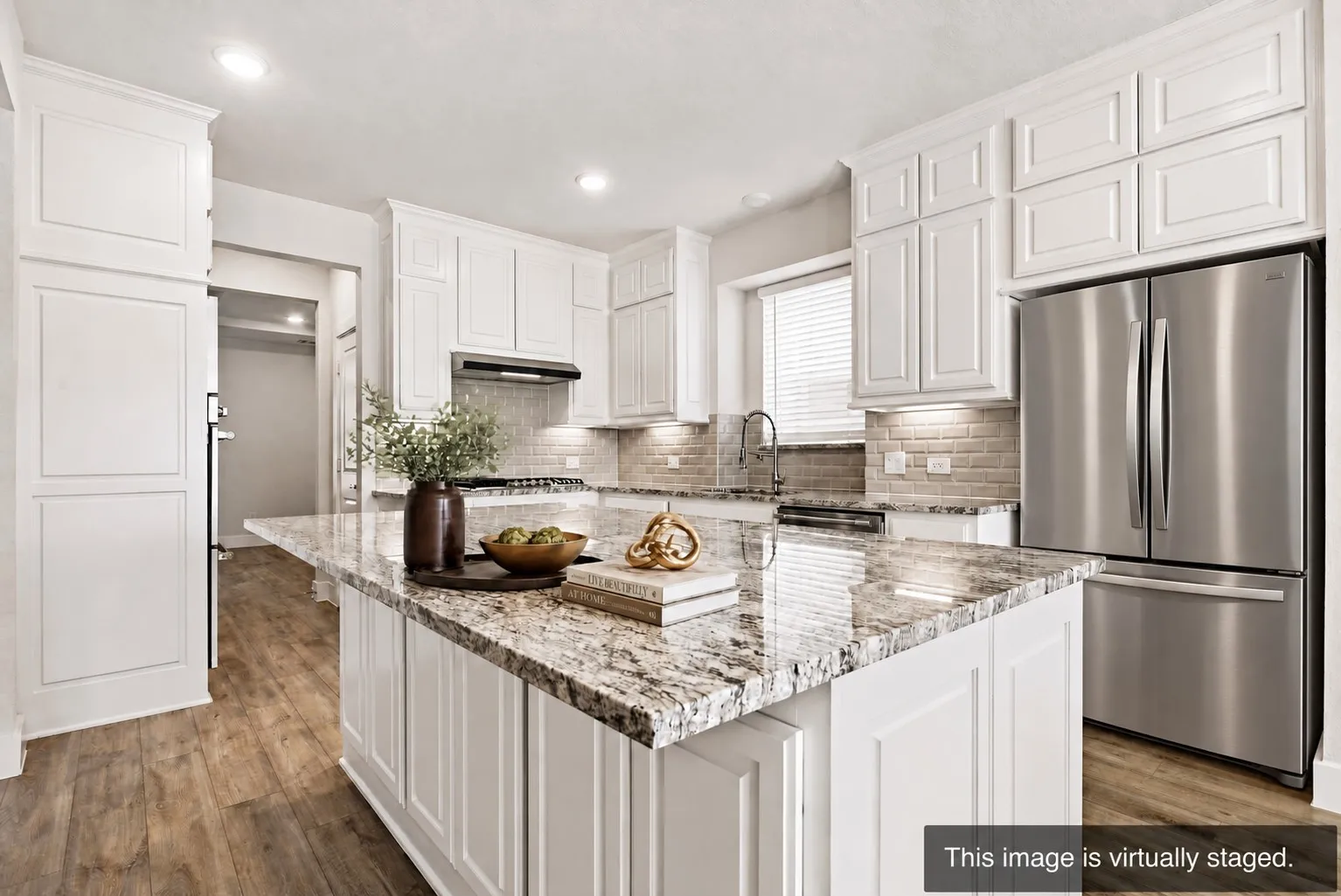 Eat in kitchen with double ovens and butlers pantry