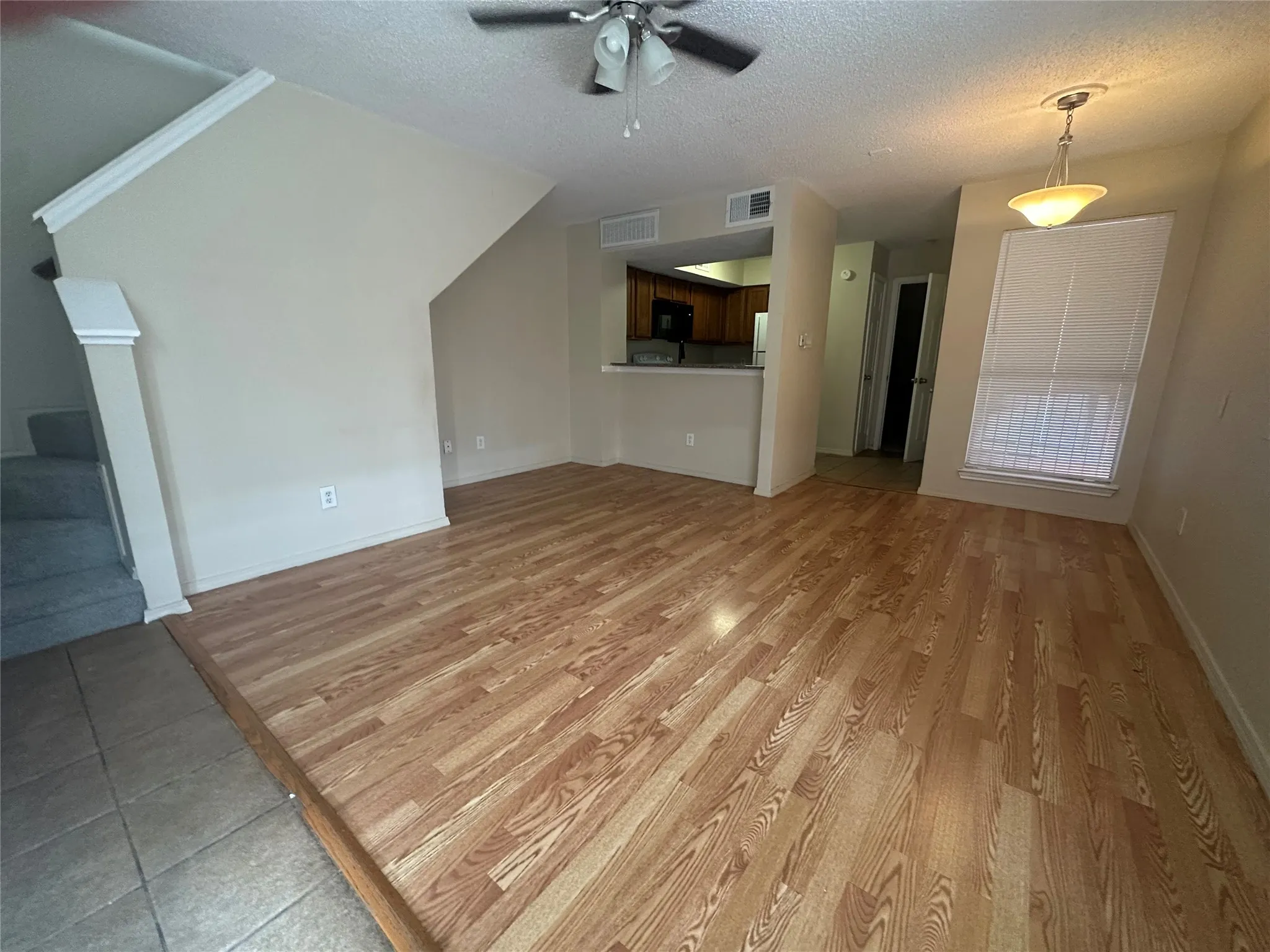 Wood-finish flooring throughout the main living area