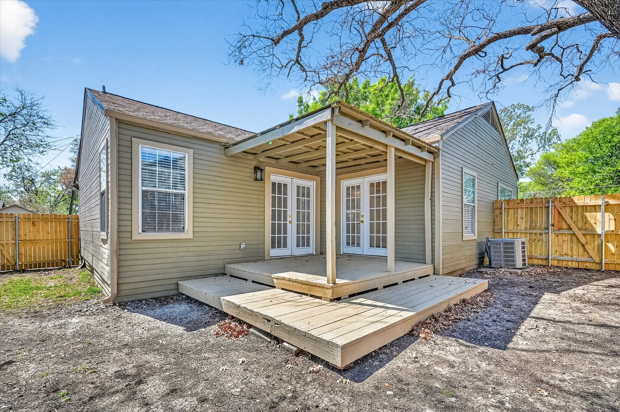 Exterior featuring horizontal siding, a covered patio, and a multi-level wood deck