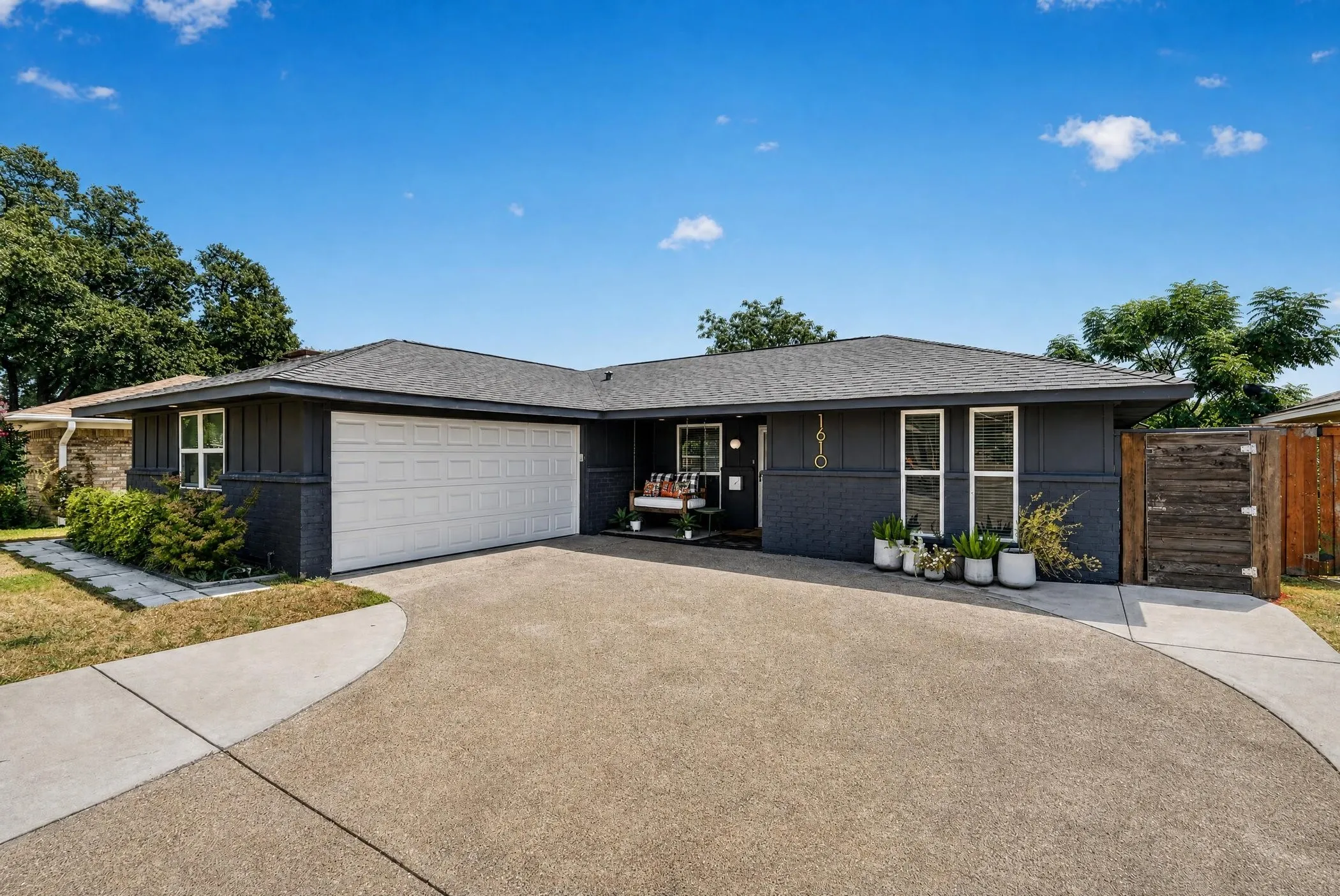 Dark gray exterior siding with white trim