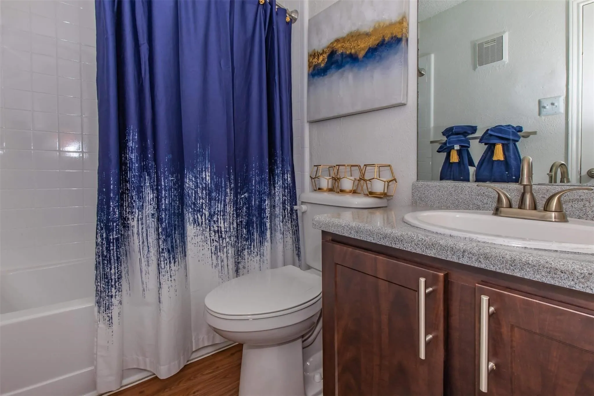 Tub and shower combination with white subway tile