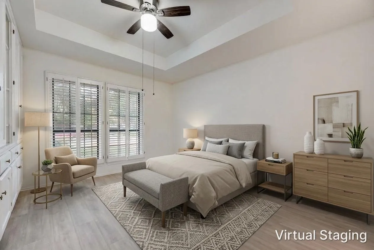Tray ceiling, ceiling fan with light fixture, wood-finish flooring, built-in cabinetry, window shutters