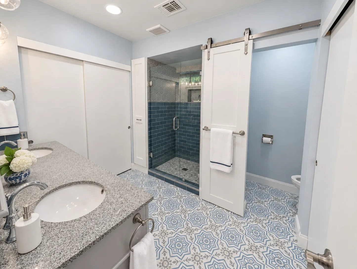 Dual vanity with granite countertops and undermount sinks