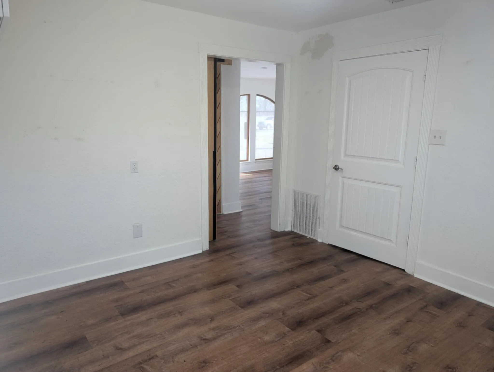 Office #2 with ADA bathroom.  Sliding barn doors for privacy.  Laminate floors