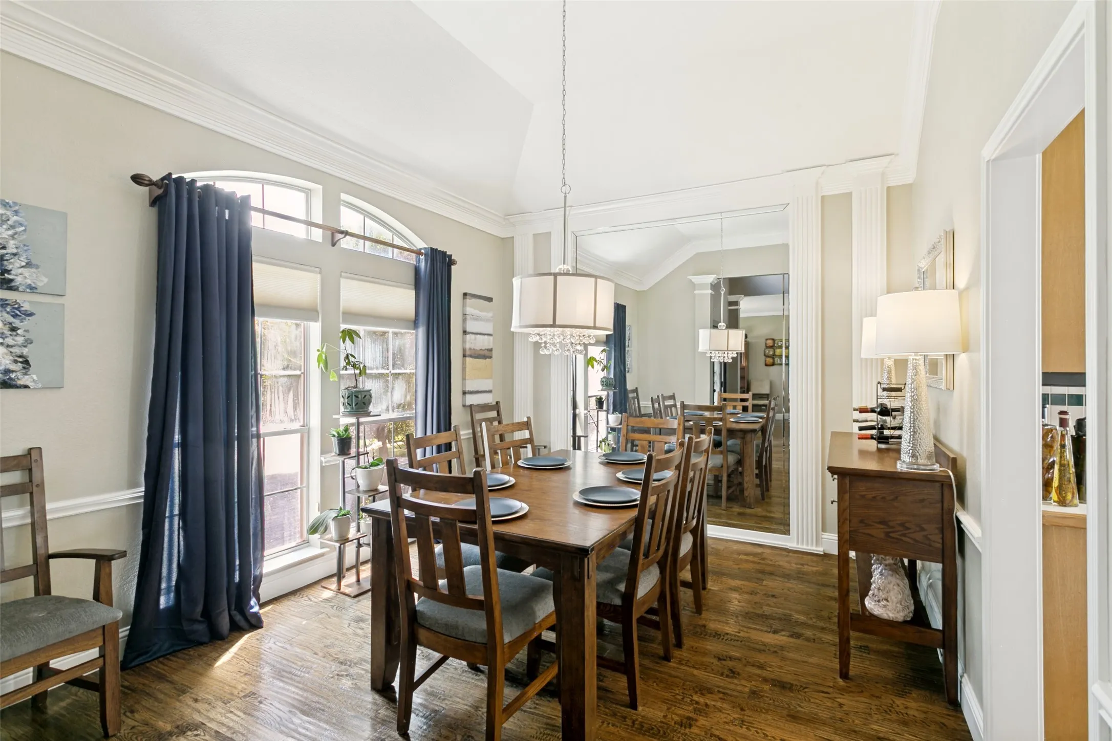 Hardwood-finish flooring, natural lighting and full-wall mirror feature