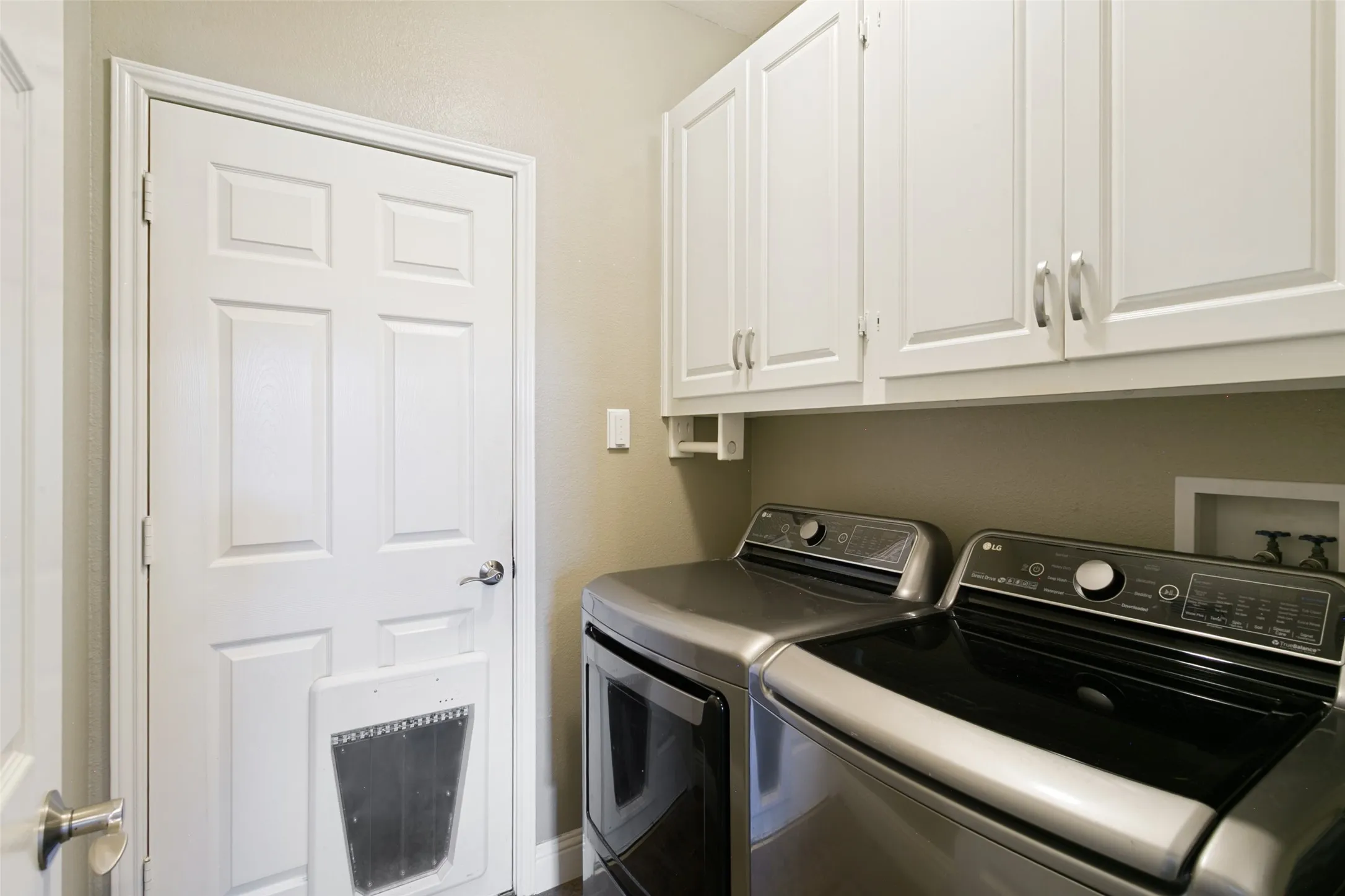 Downstairs laundry room near garage