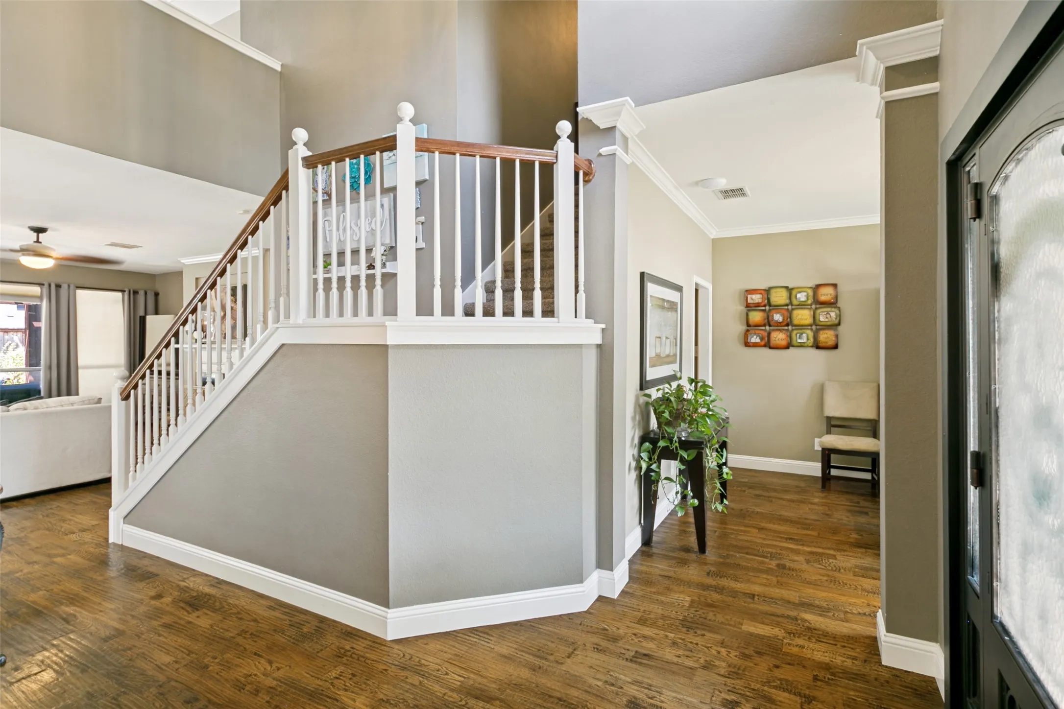 Entryway view of living room, office and stairway