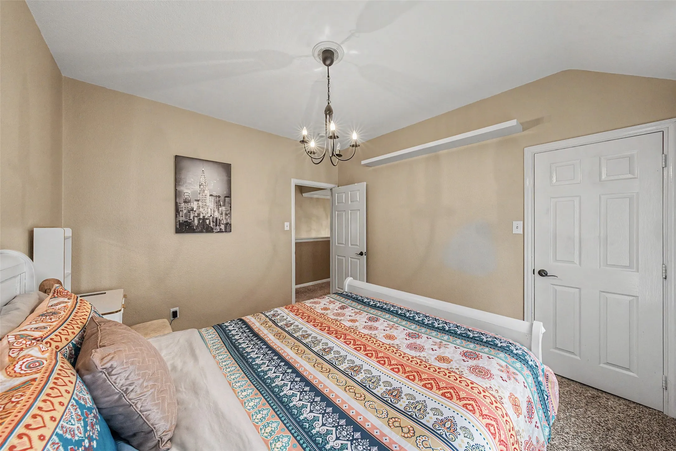 Vaulted ceiling with an attached chandelier