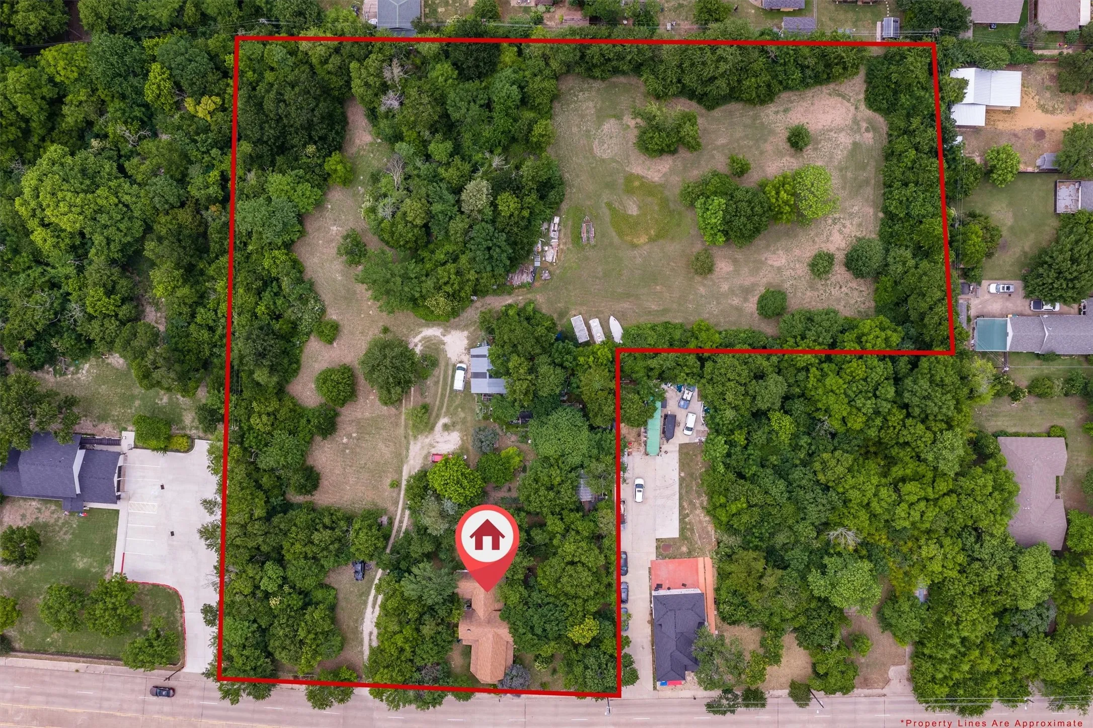 Expansive property featuring mature trees and cleared areas