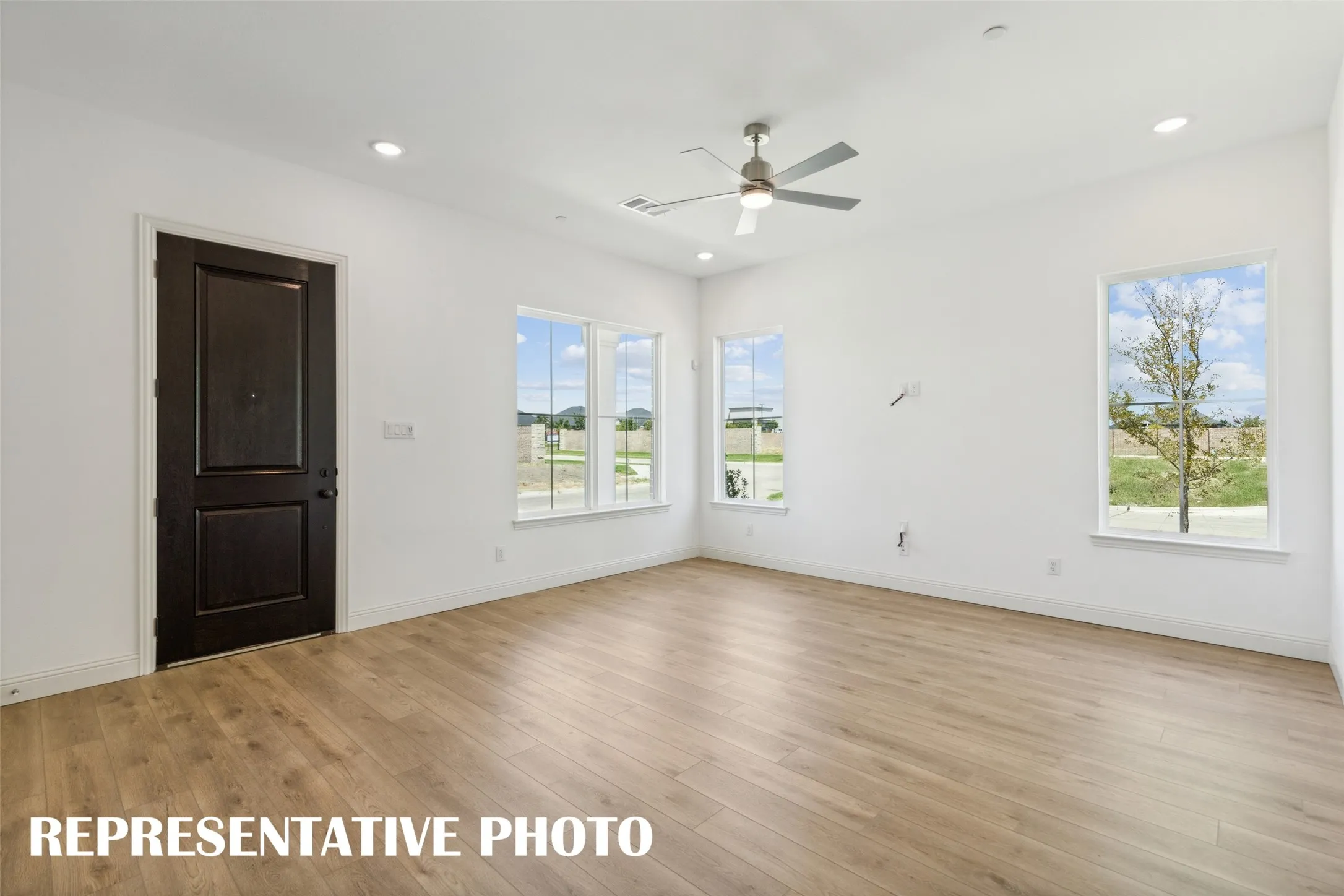 Our end unit Martin plan offers multiple walls of windows to flood the home with natural light.  REPRESENTATIVE PHOTO