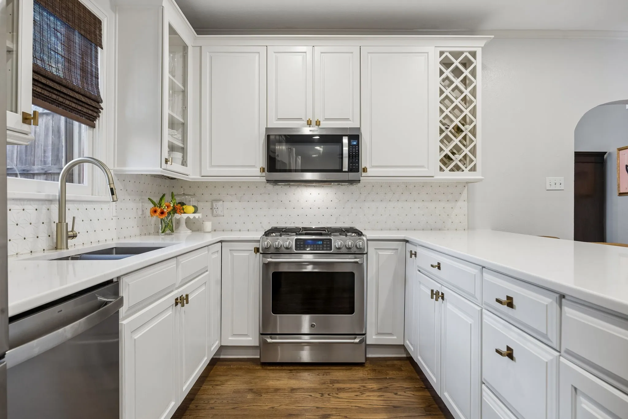 Kitchen features stainless steel appliances.