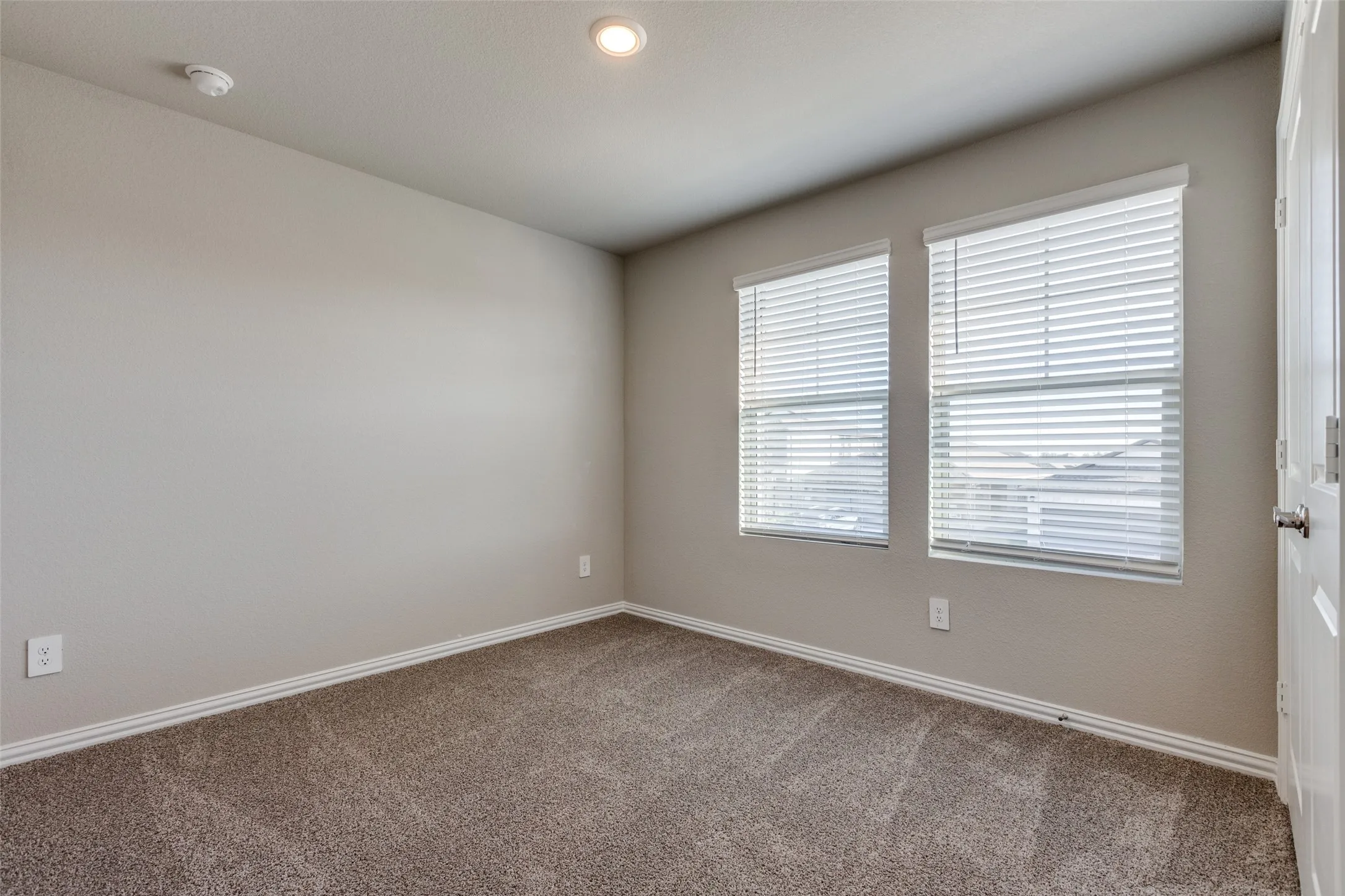 Empty room with carpet flooring