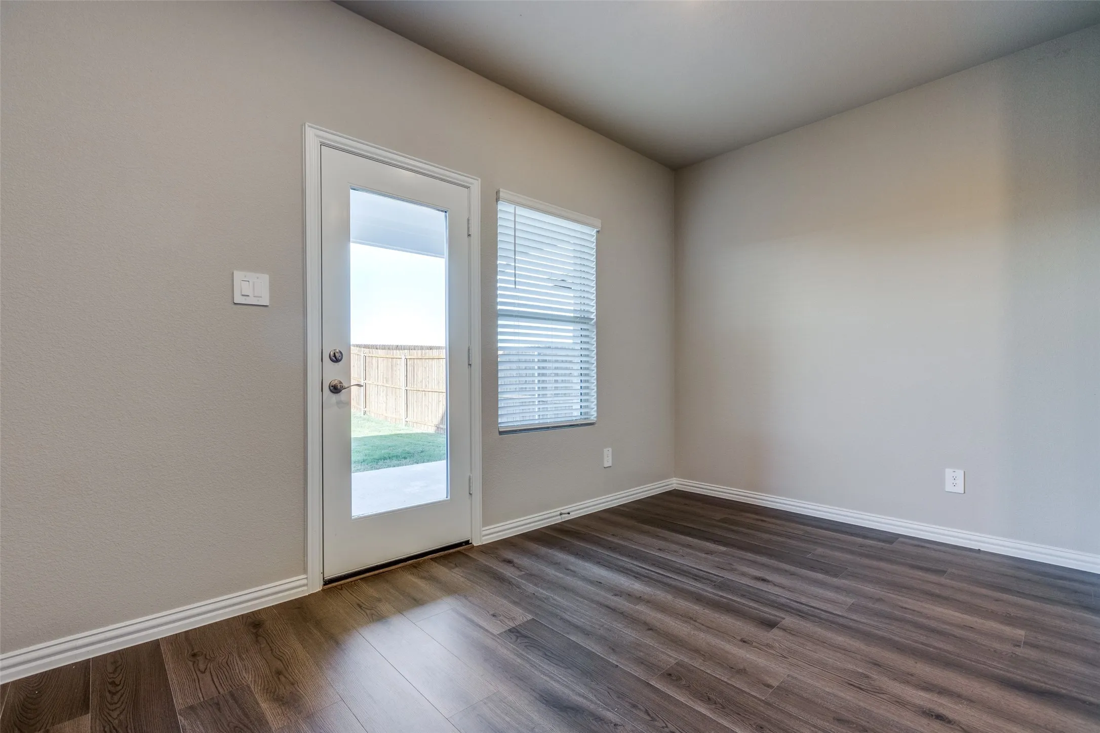 Doorway featuring dark hardwood / wood-style flooring and a wealth of natural light