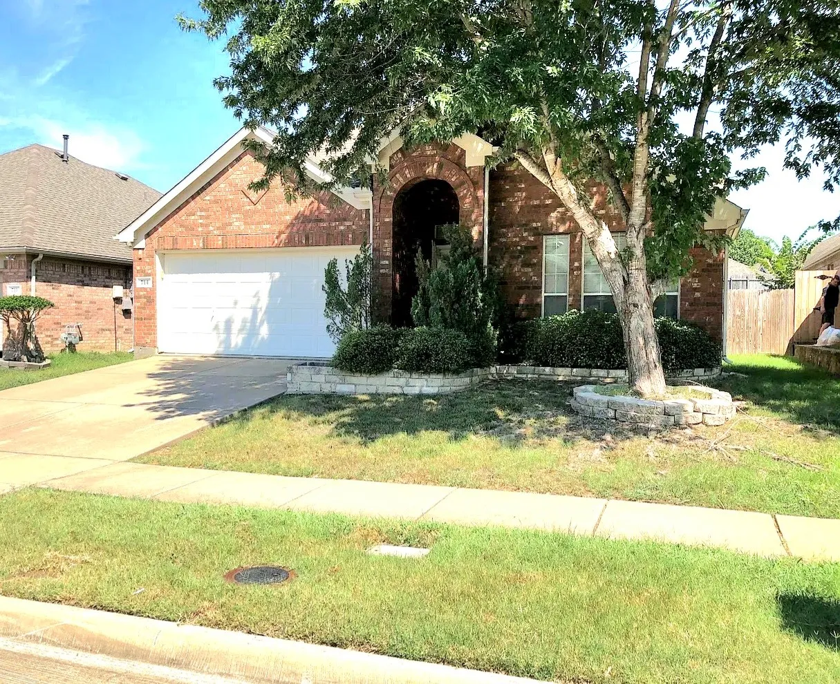 Red brick exterior with an arched entry