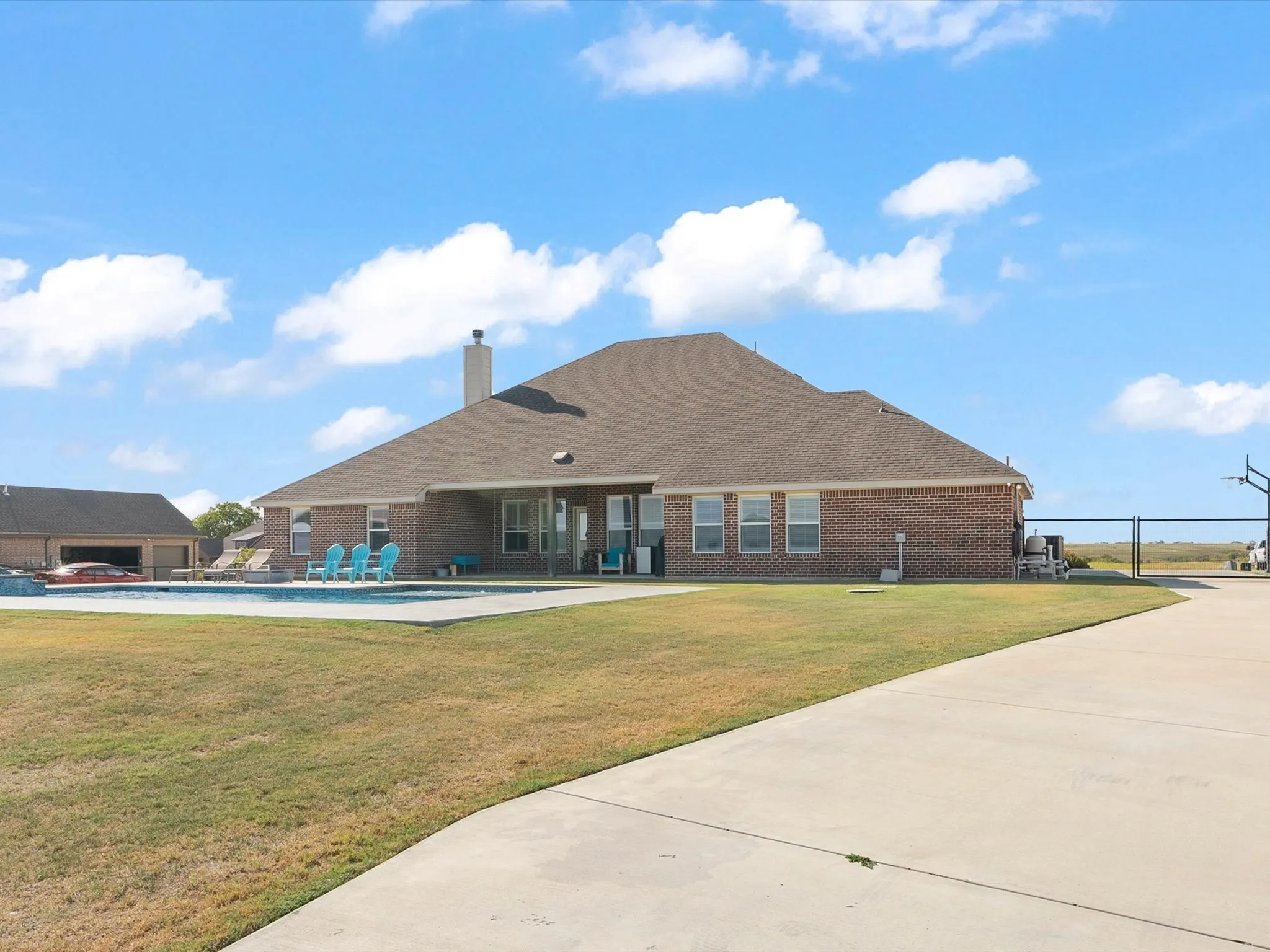 back yard with extended drive, pad parking