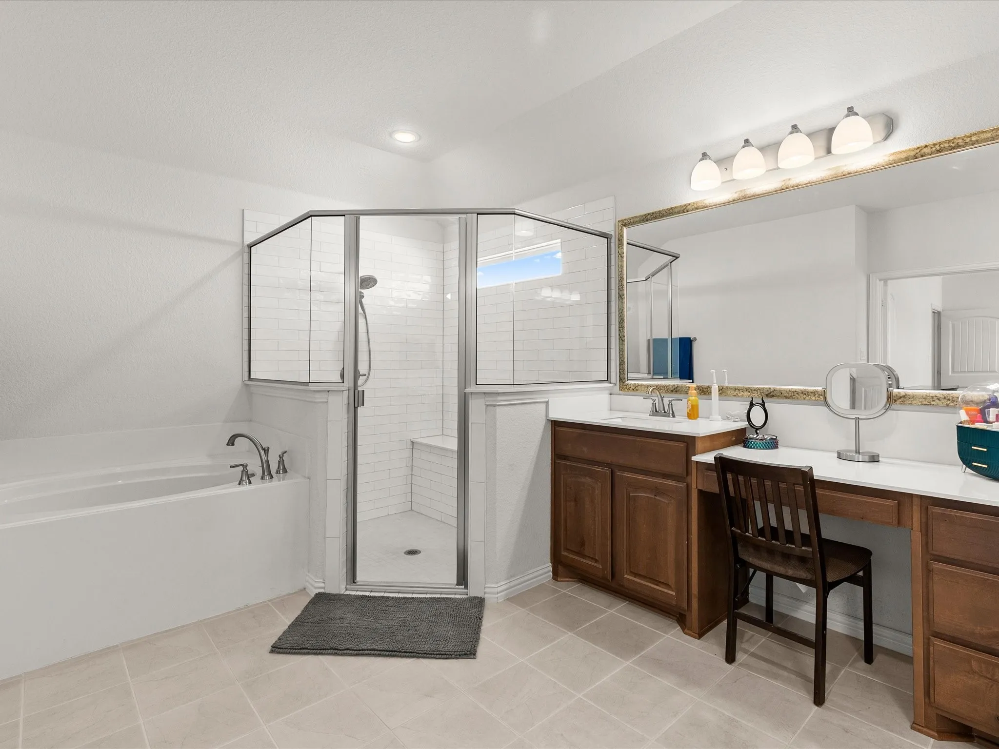 primary bath seated vanity, soaking tub, oversized shower with seating