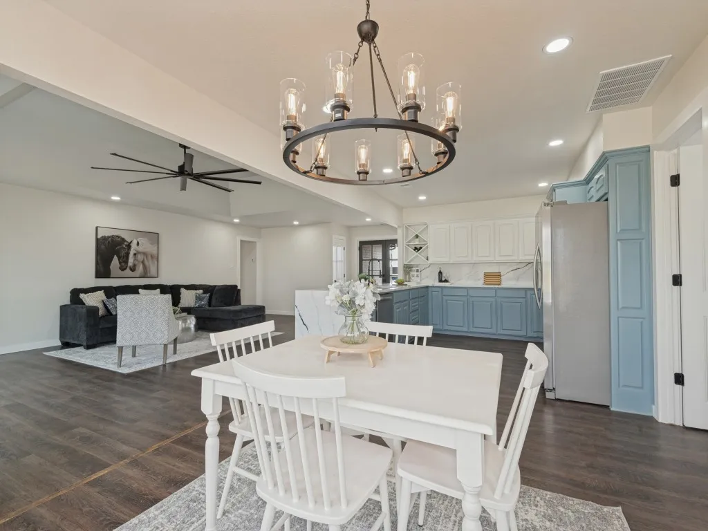 Open-concept living space with dark wood-finish flooring
