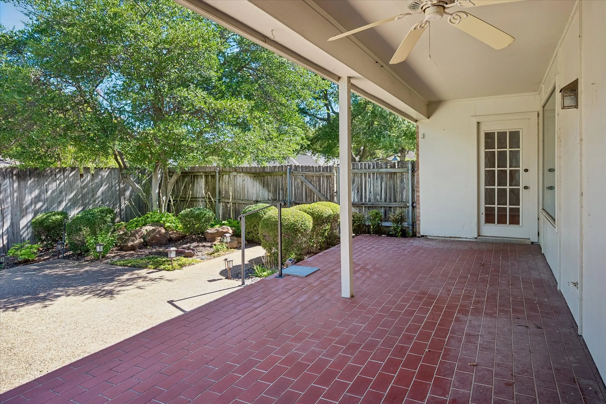 View of the covered patio and landscaping.