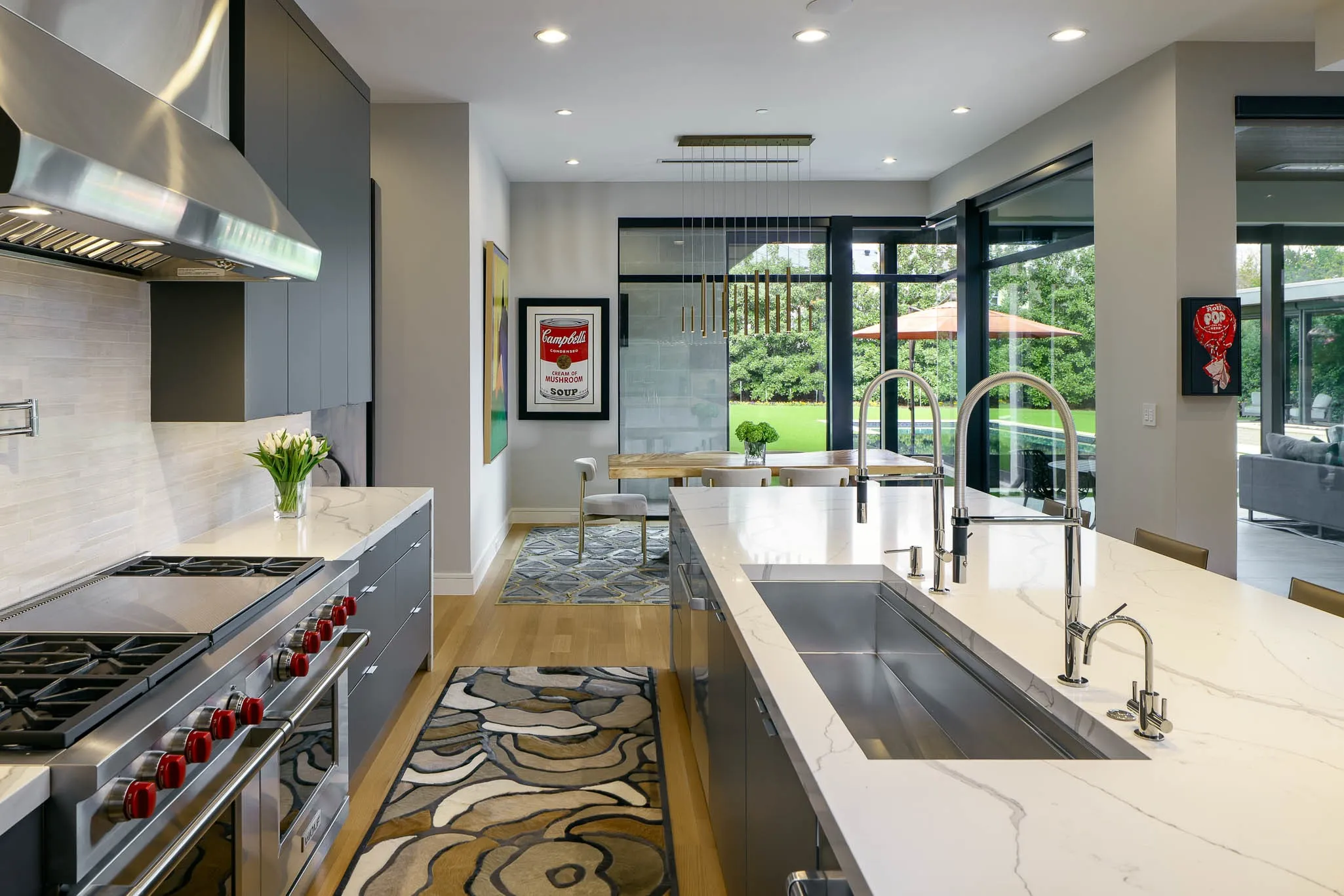 Gourmet kitchen with premium appliances and adjacent breakfast room