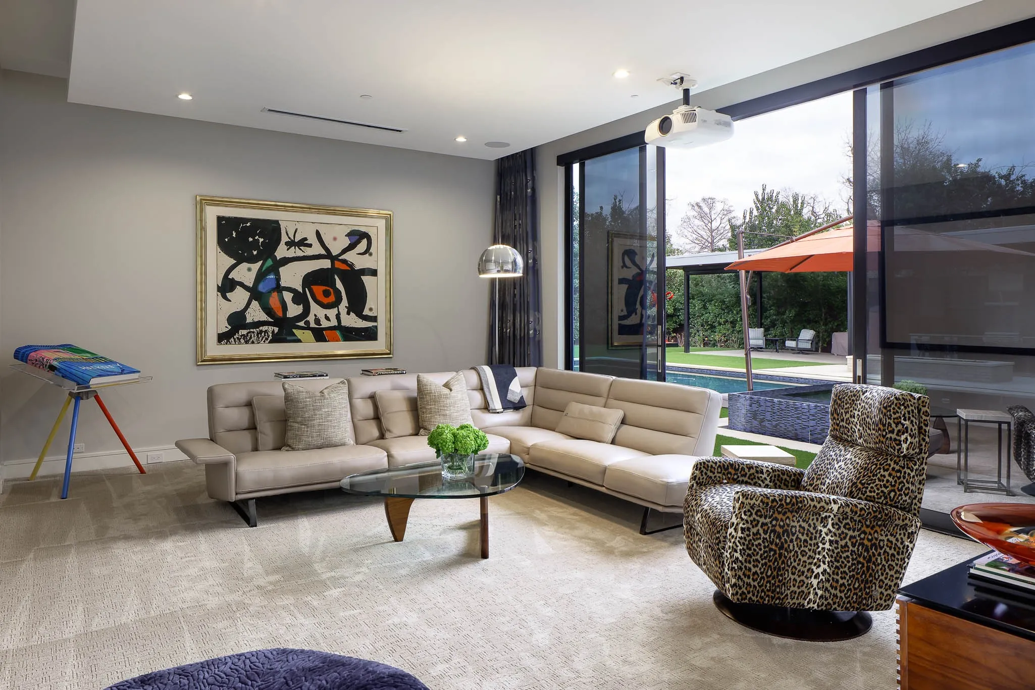 Media room with sliding doors to backyard and​​‌​​​​‌​​‌‌​‌‌​​​‌‌​‌​‌​‌​​​‌​​ pool