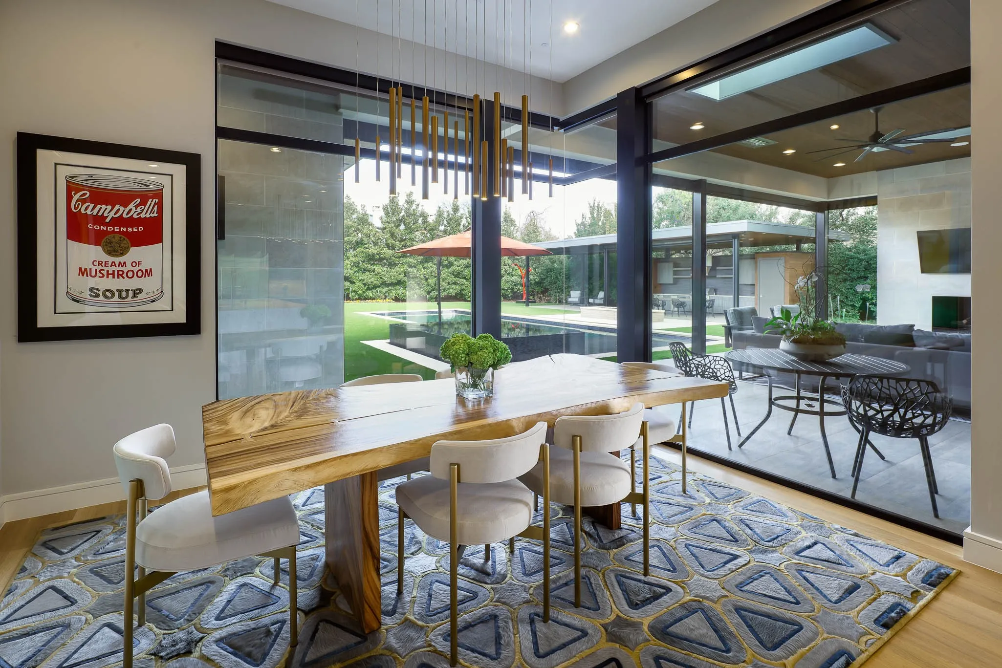 Breakfast room overlooking landscaped backyard and pool