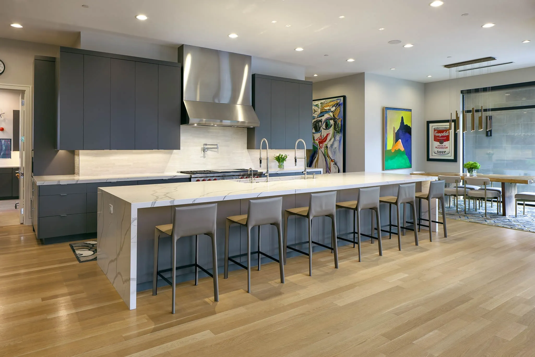 Gourmet kitchen with premium appliances and adjacent breakfast room