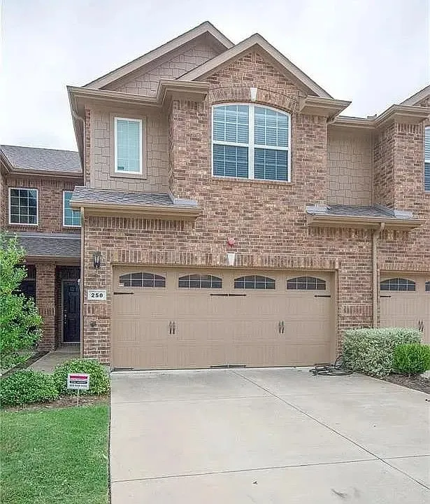 Brick exterior featuring multiple gables