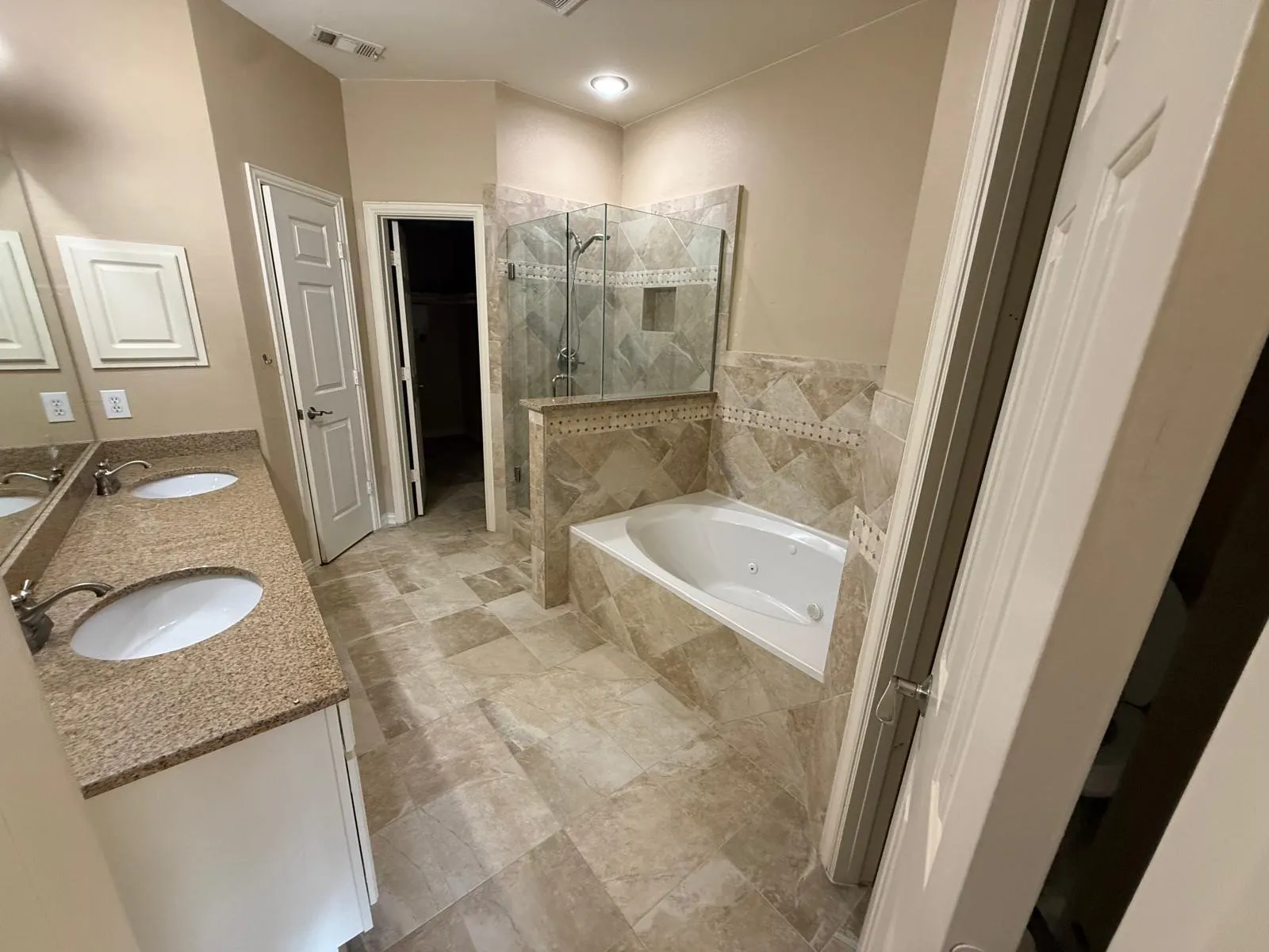 Dual vanity with undermount sinks and stone countertops