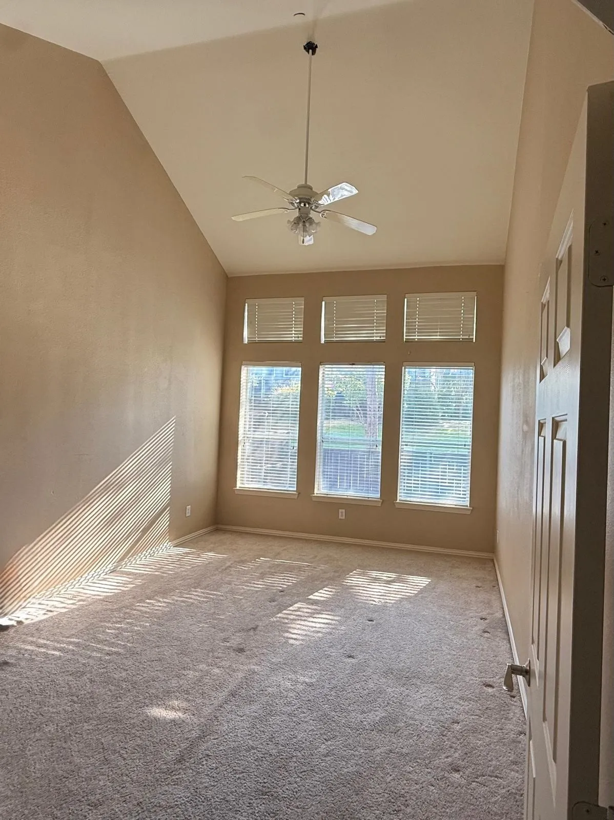 Vaulted ceiling with an attached ceiling fan